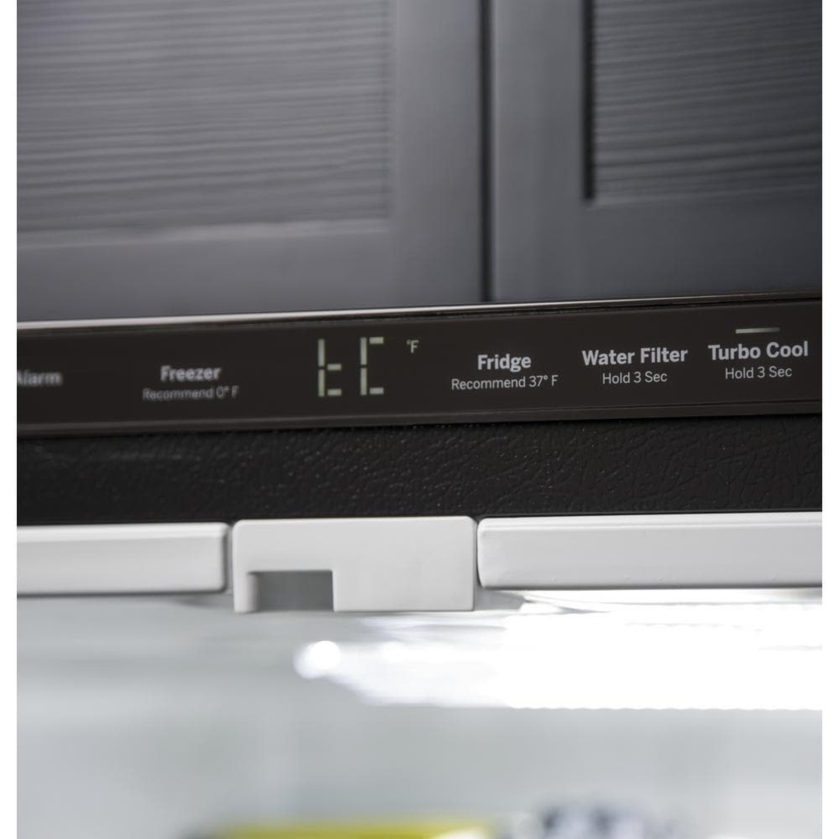 Close-up of the refrigerator's internal control panel with digital temperature display and buttons for fridge, freezer, water filter, and Turbo Cool