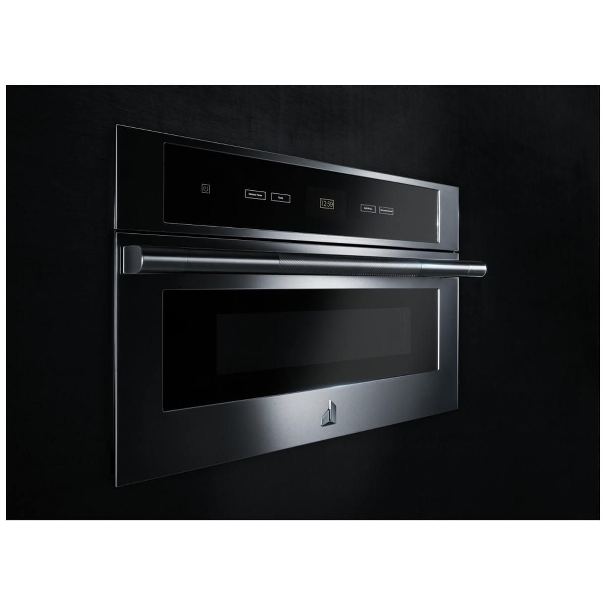 Angled view of a JennAir built-in microwave with stainless trim, black glass front, and prominent handle