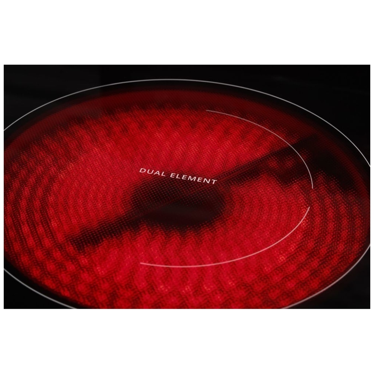 Close-up of a glowing radiant cooktop element labeled dual element