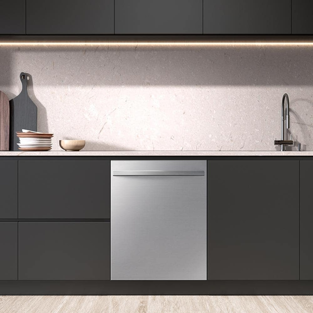 Samsung stainless steel dishwasher installed under a kitchen countertop with a bar handle