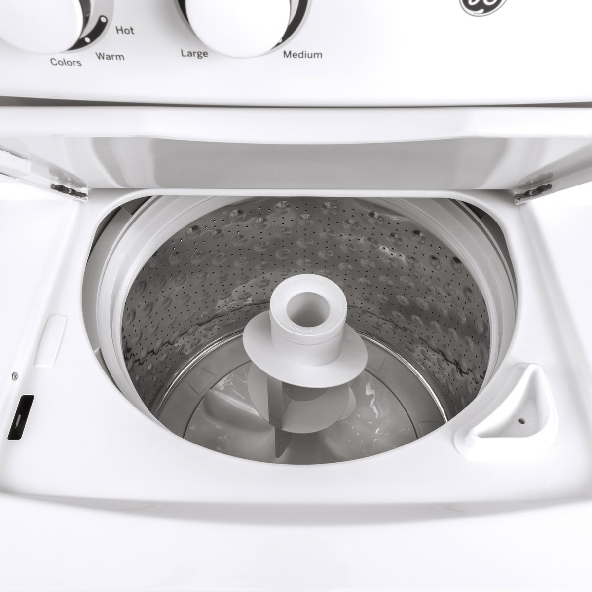Top-load washer tub with a central agitator and stainless steel wash basket