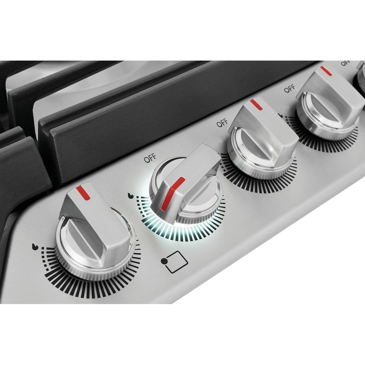Close-up of Frigidaire Gallery cooktop control knobs with one knob illuminated by a backlit ring