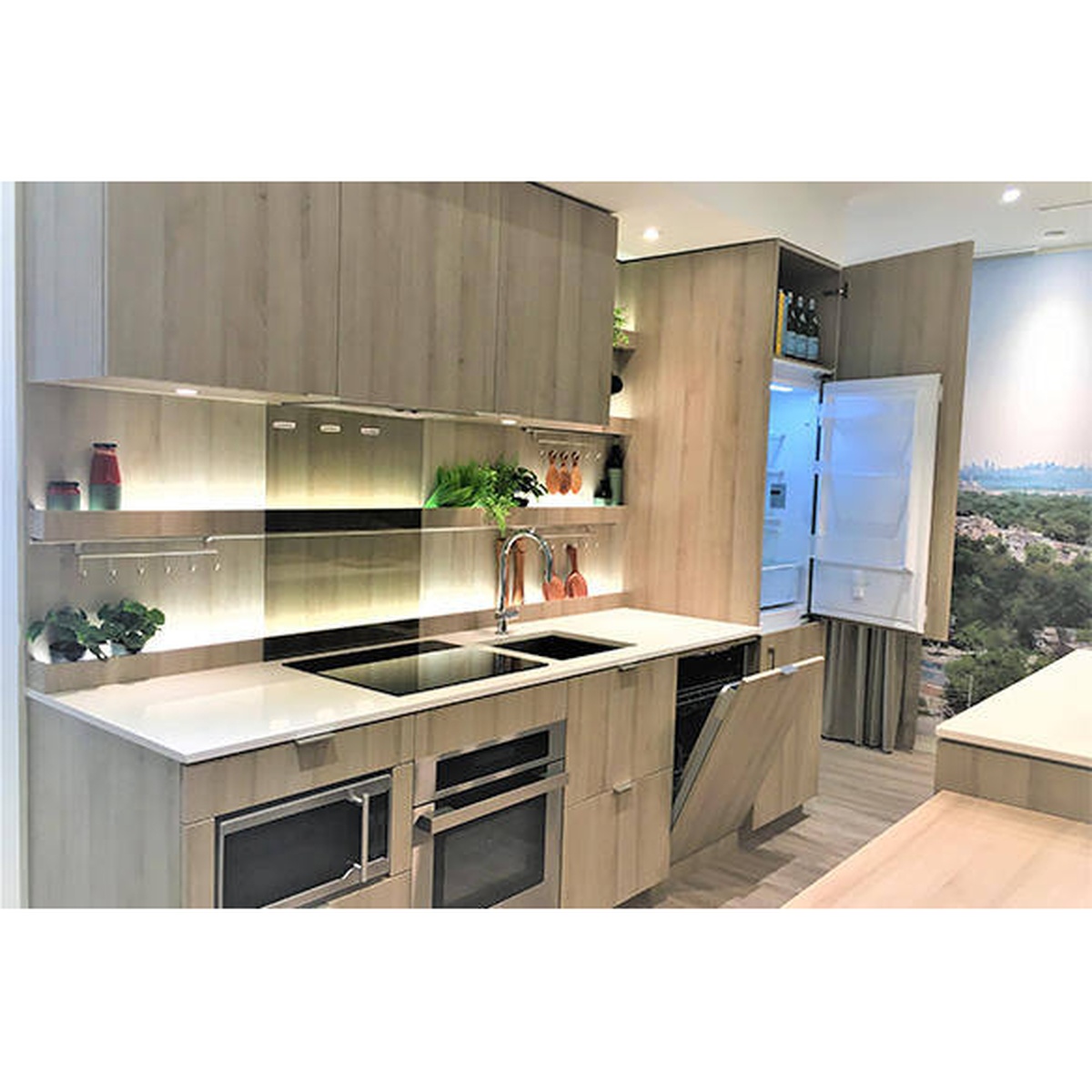 Built-in refrigerator installed flush with modern cabinetry in a contemporary kitchen