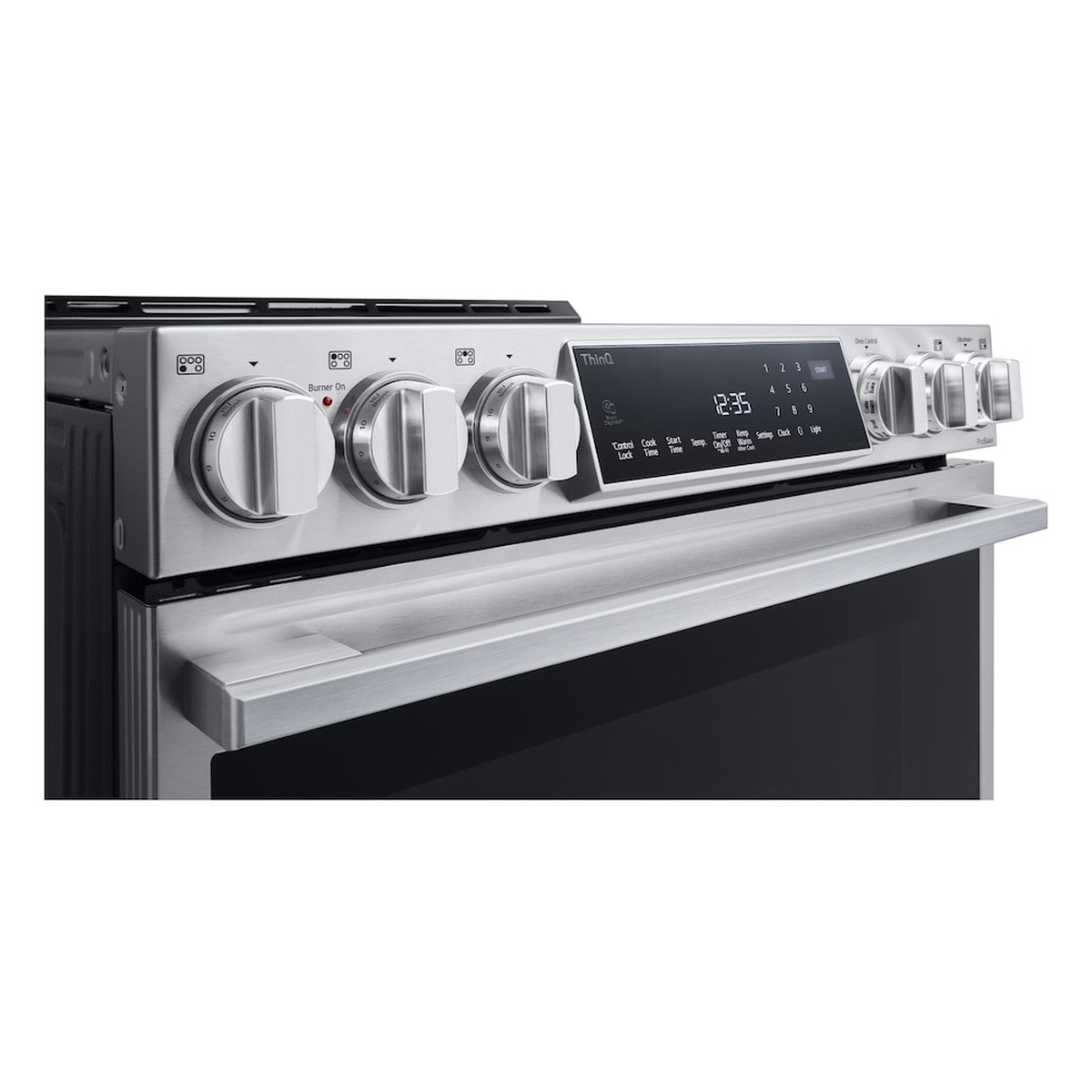 Angled close-up of the stainless front control panel with metal knobs and a ThinQ digital display