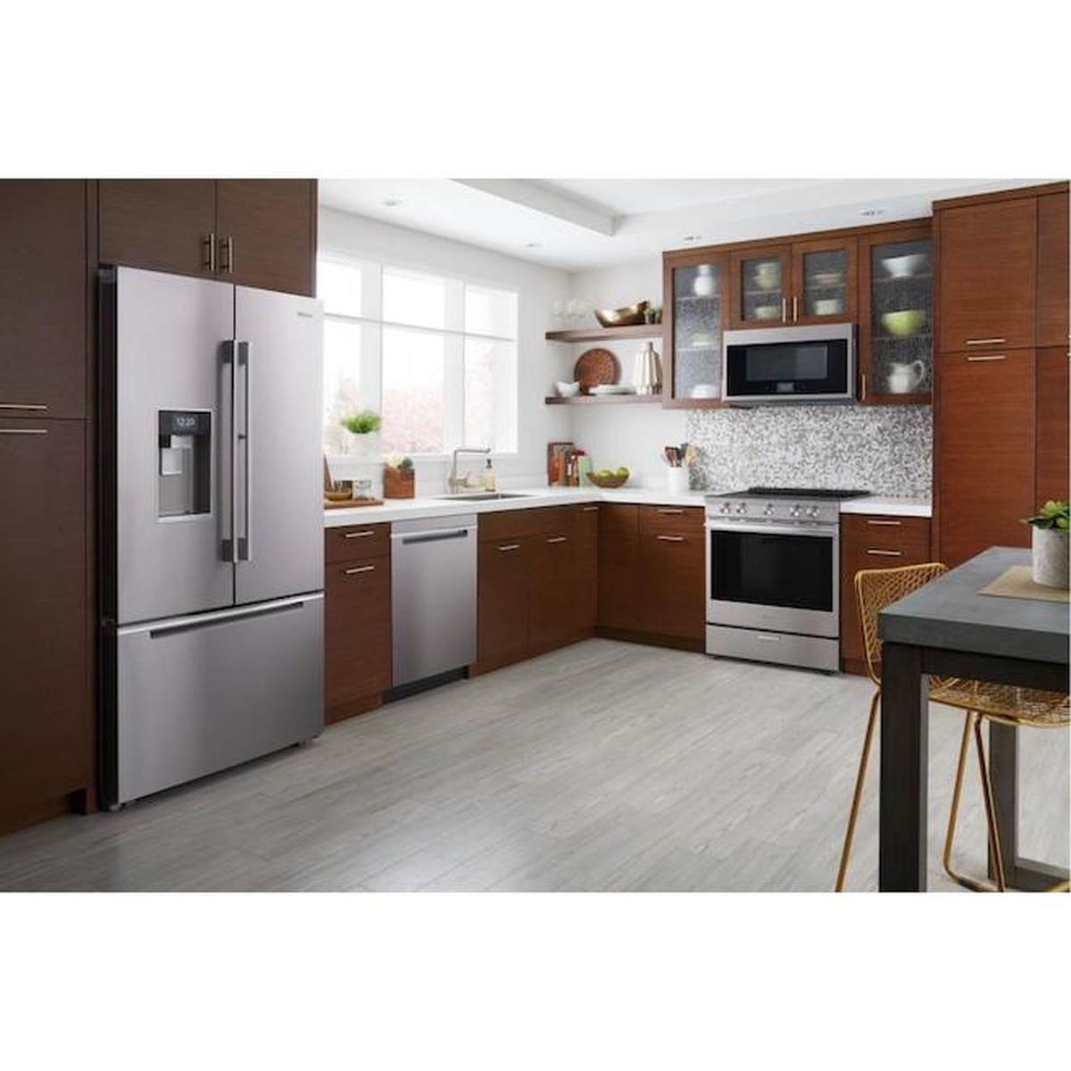 Kitchen scene with a stainless steel slide-in electric range installed between cabinets
