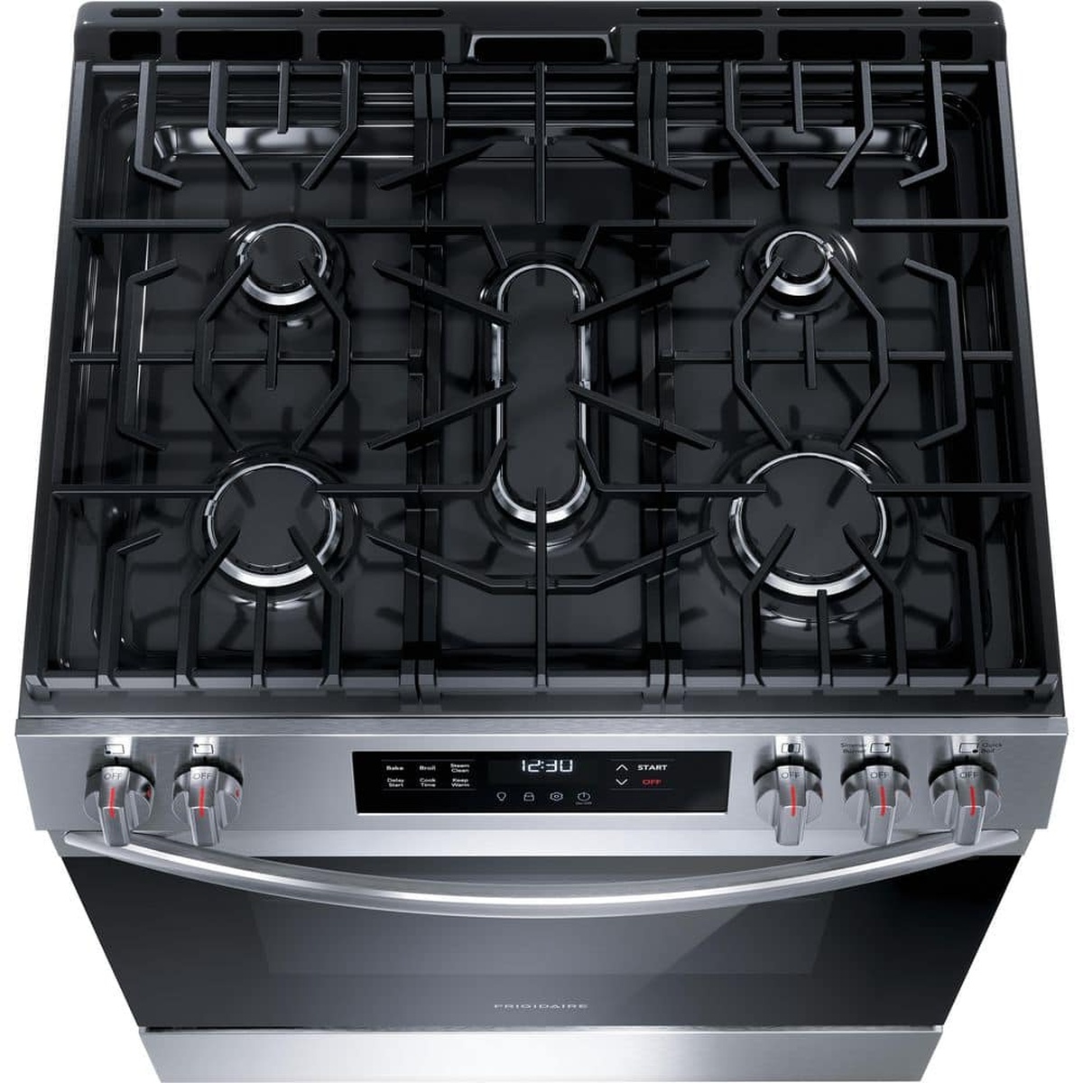 Angled top view of the Frigidaire gas range cooktop showing five burners, continuous grates, and the front control panel with a digital display