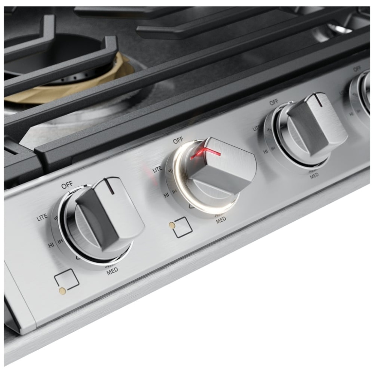 Close-up of Frigidaire Professional cooktop knobs showing an illuminated backlit ring