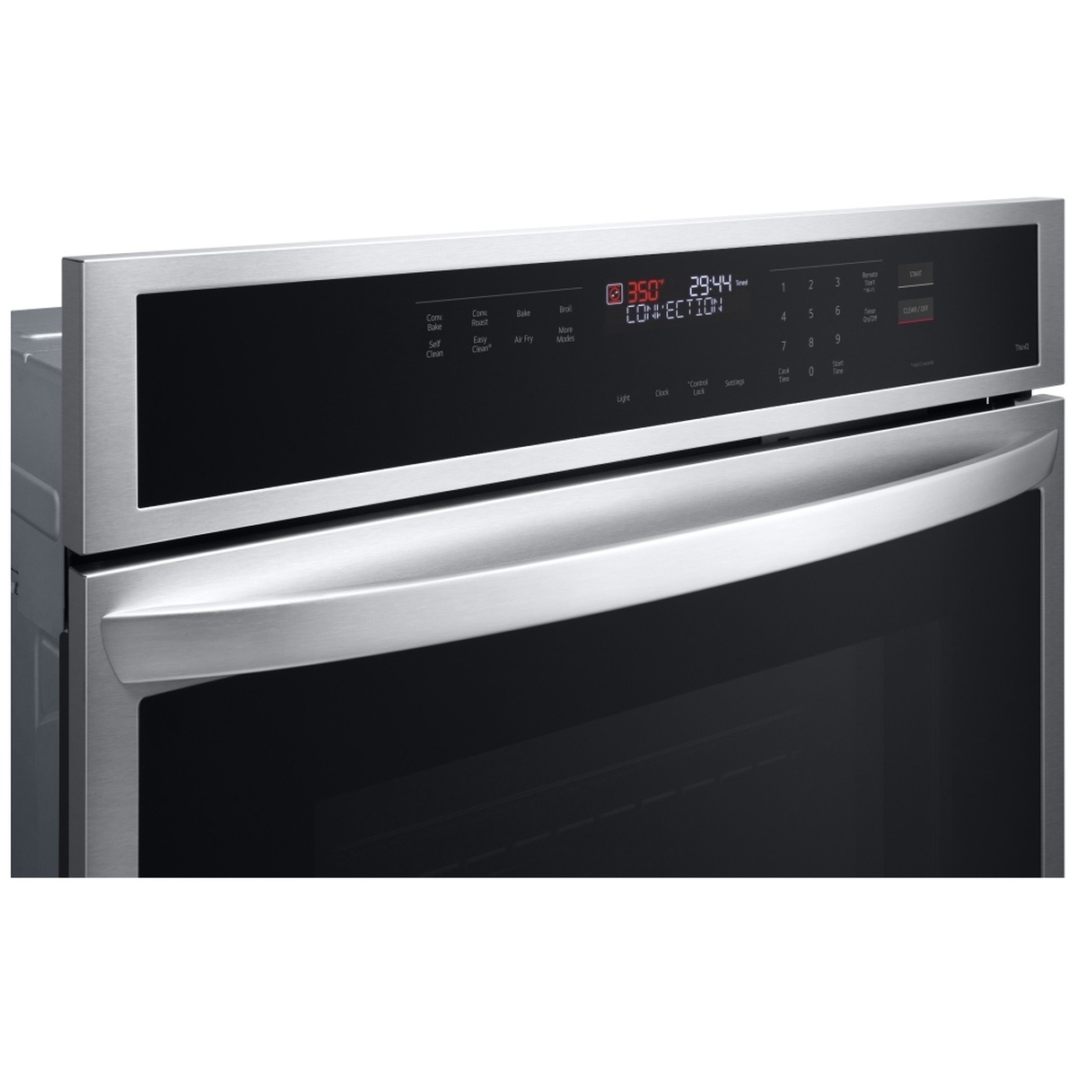 Angled close-up of the LG wall oven SmoothTouch glass control panel with digital display and touch keypad