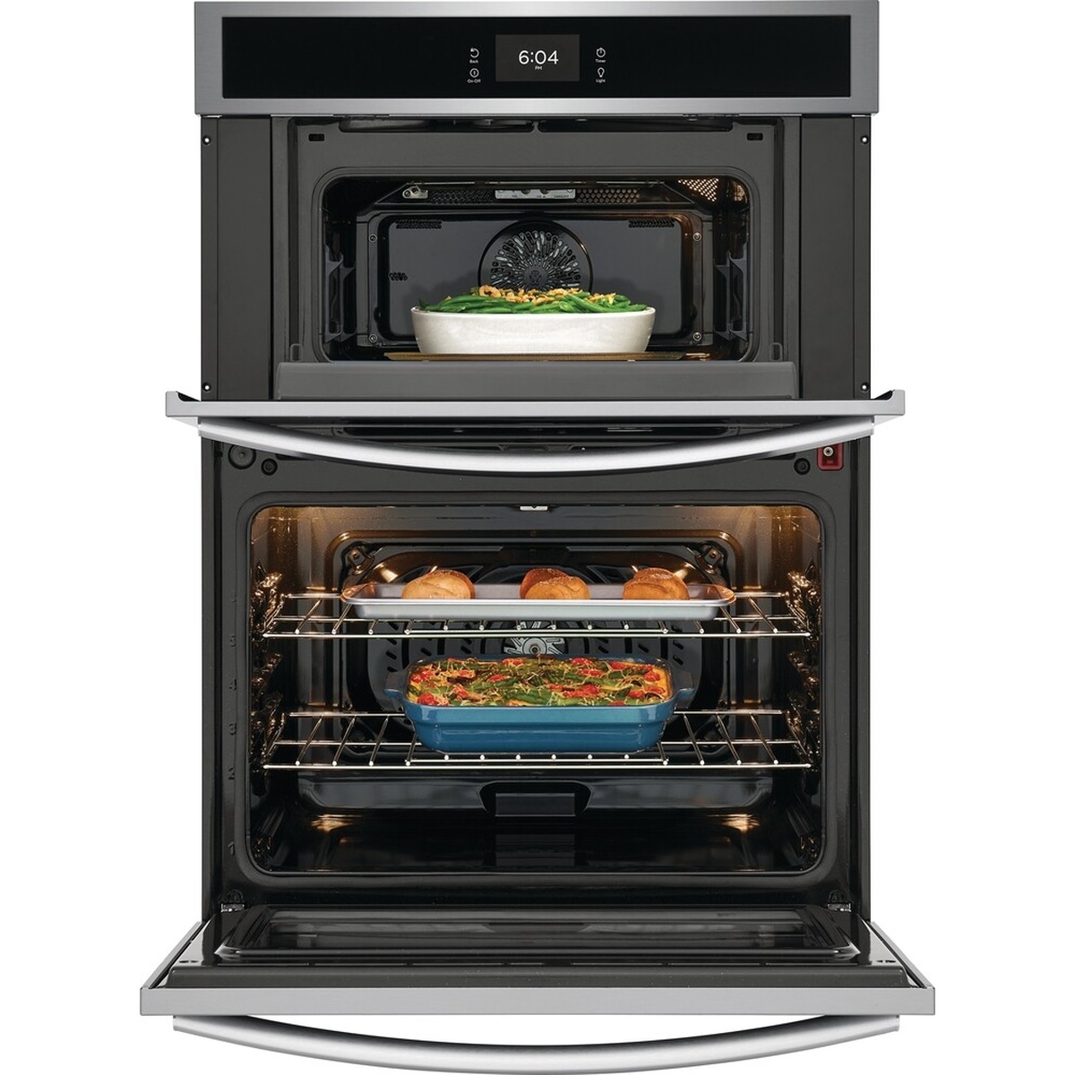 Frigidaire combination wall oven with the microwave and oven doors open, showing the upper cavity with a dish and the lower oven with multiple racks and food