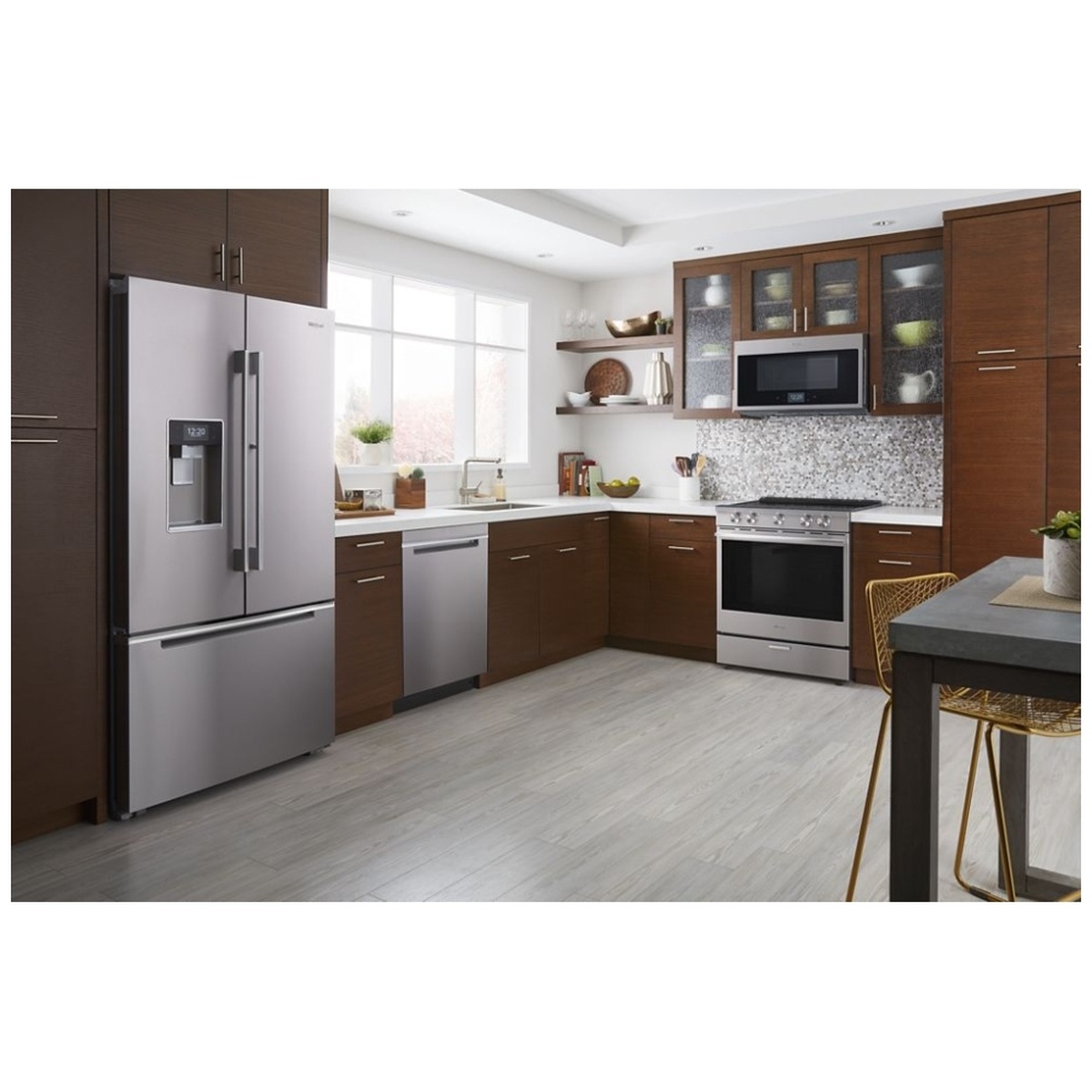 Kitchen scene showing a stainless over-the-range microwave installed above a range