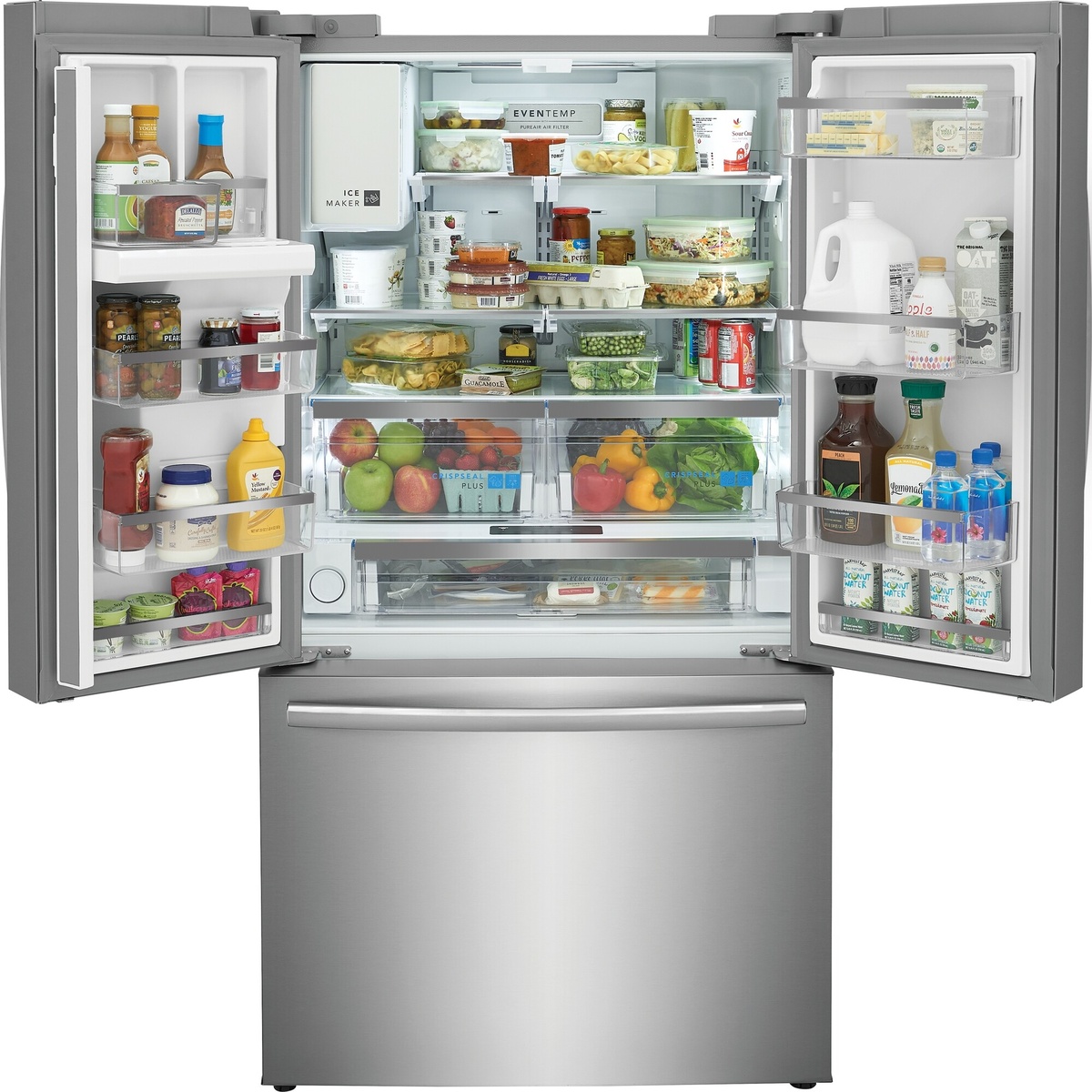 Open Frigidaire French door refrigerator interior filled with food, showing adjustable shelves, door bins, in-door ice maker, and CrispSeal Plus crisper drawers