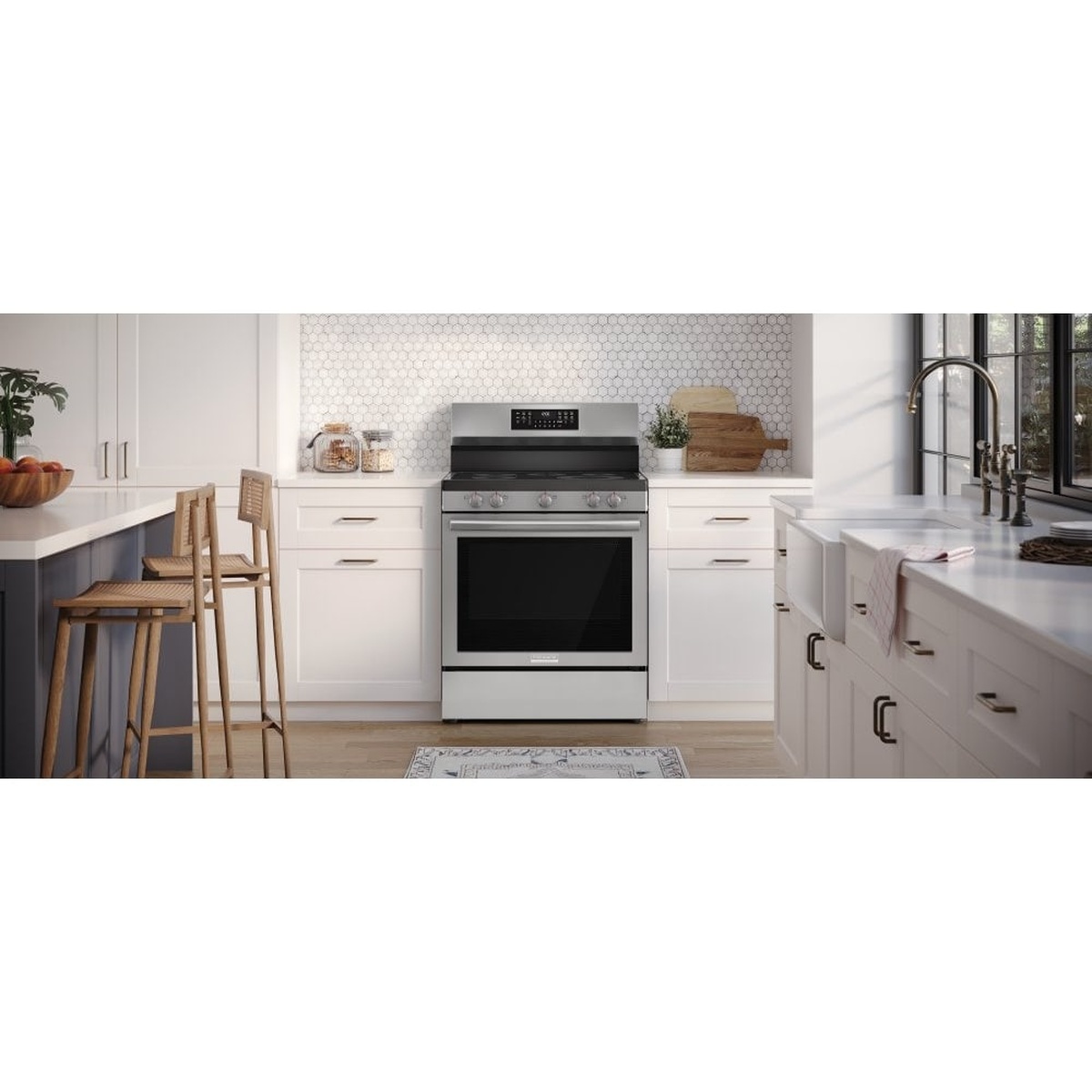 Frigidaire Gallery freestanding stainless steel electric range installed between white kitchen cabinets