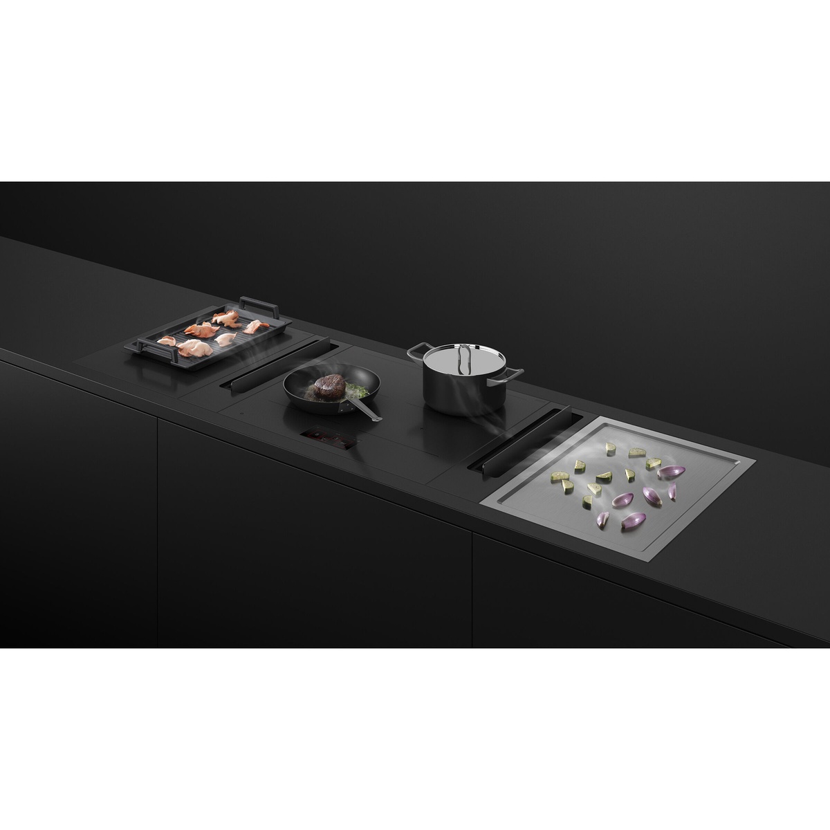 Modular cooktop suite installed in a dark countertop, with a stainless teppanyaki plate on the right and other cooking modules beside it