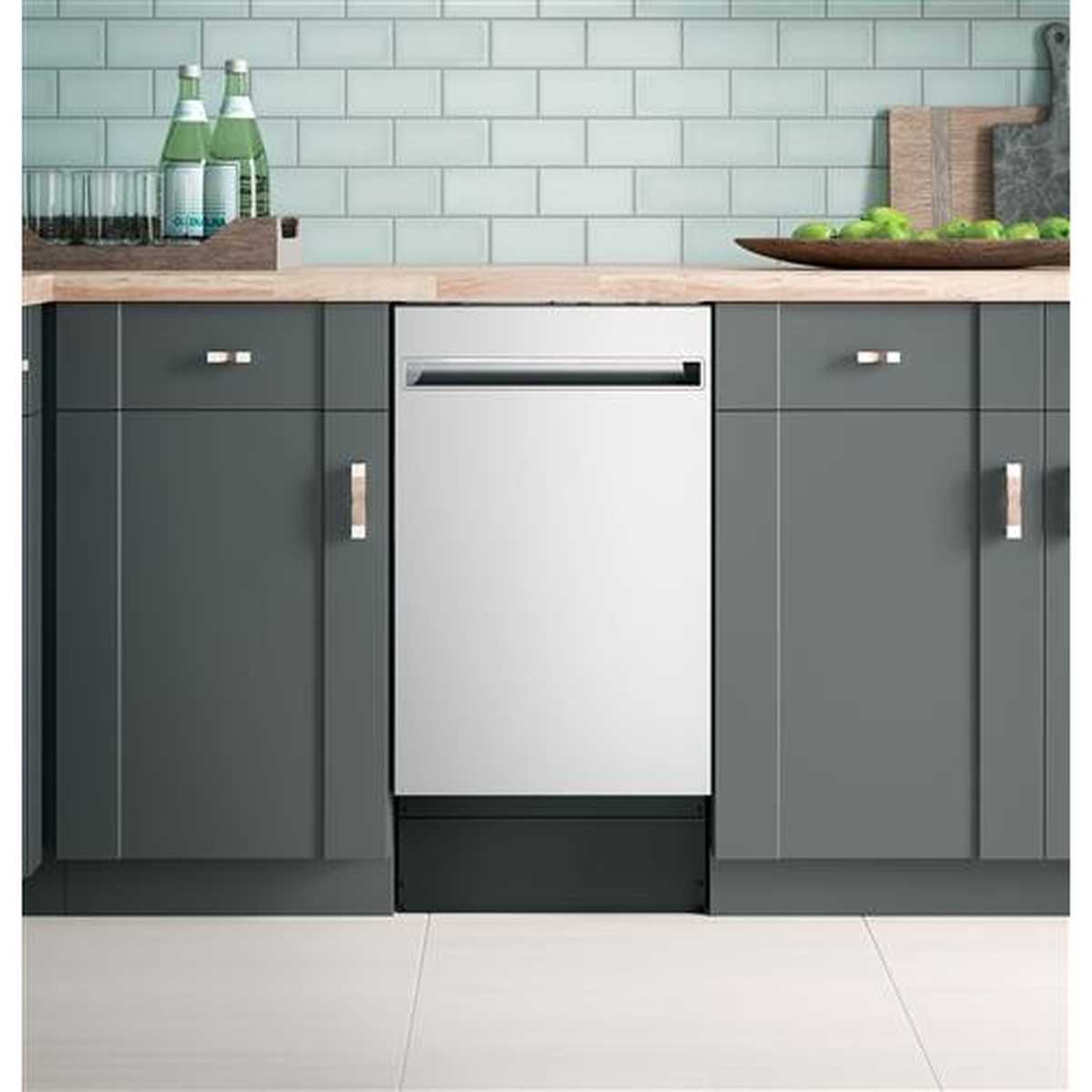 Haier stainless 18-inch fully integrated dishwasher installed between kitchen cabinets with a recessed pocket handle