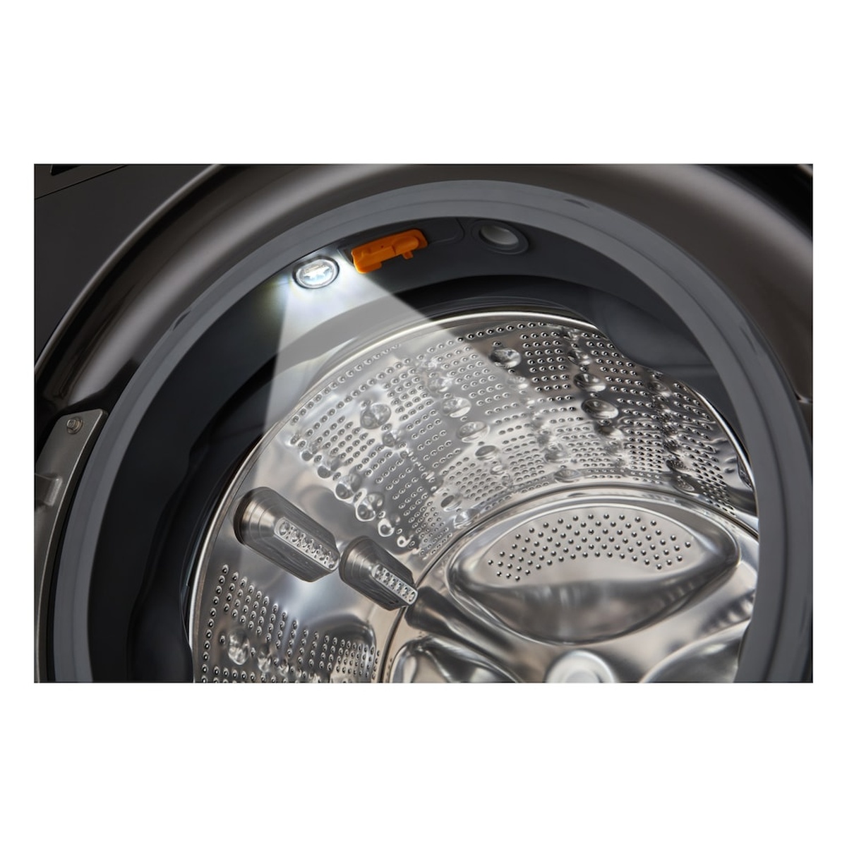 Inside view of the washer drum showing a stainless steel interior with an interior light