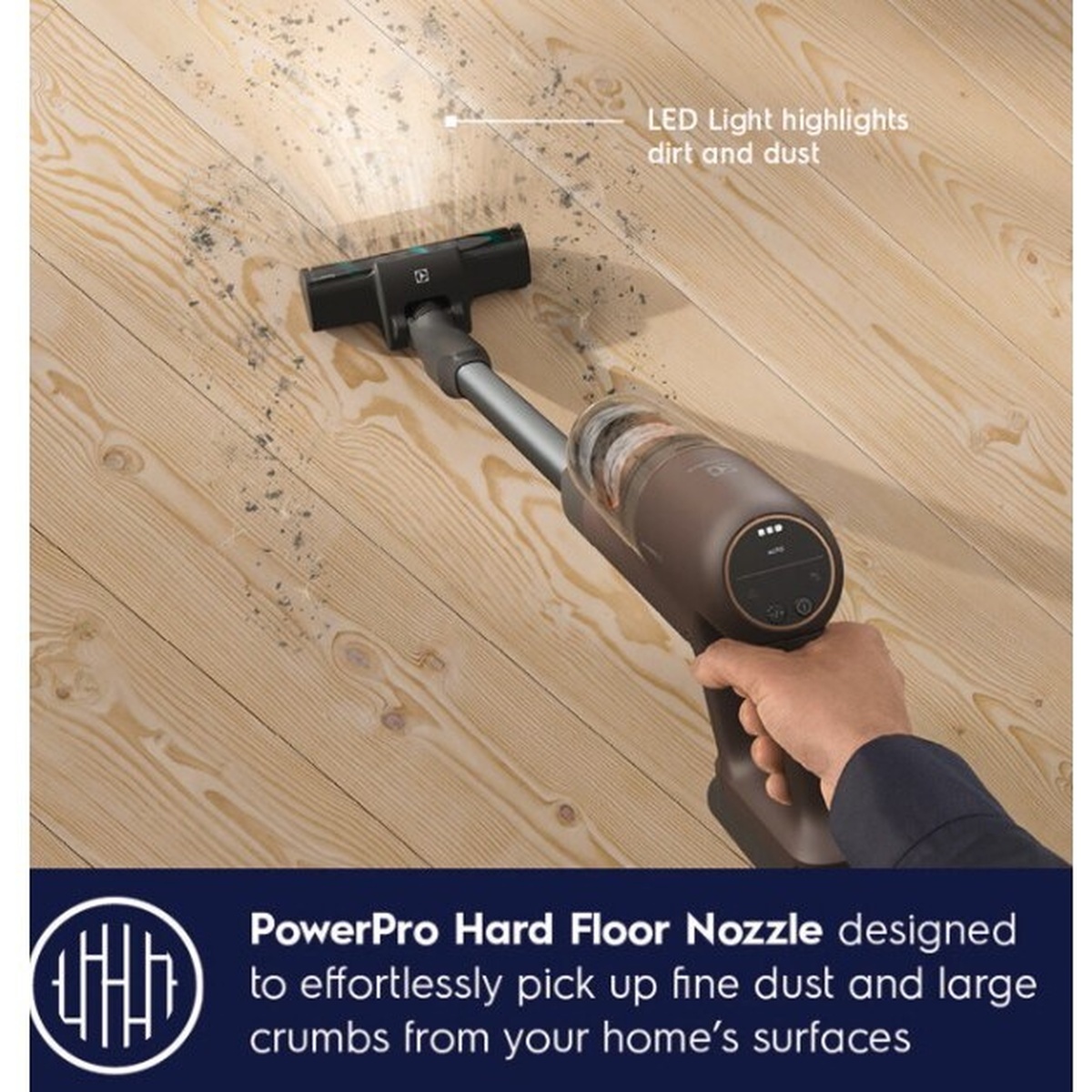Electrolux cordless vacuum cleaning a wood floor with the PowerPro hard floor nozzle and LED light highlighting dirt and dust