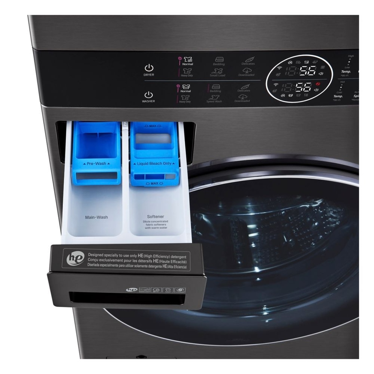 Close-up of the LG WashTower detergent drawer pulled open, showing labeled detergent and softener compartments beneath the center control panel