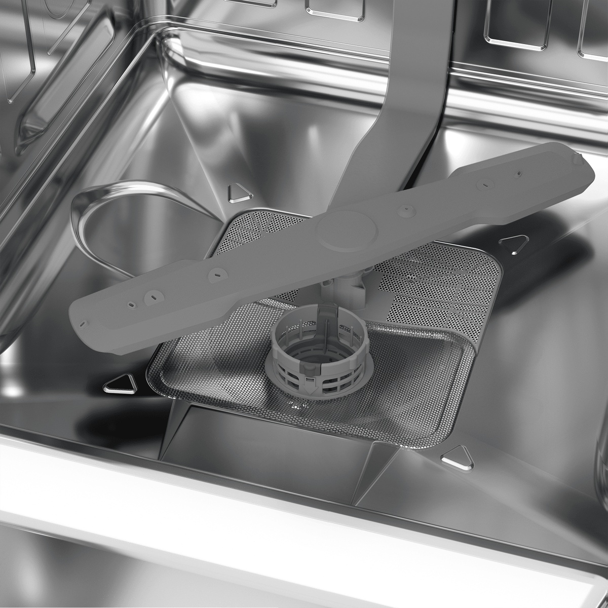 Stainless dishwasher interior with spray arm and filter area