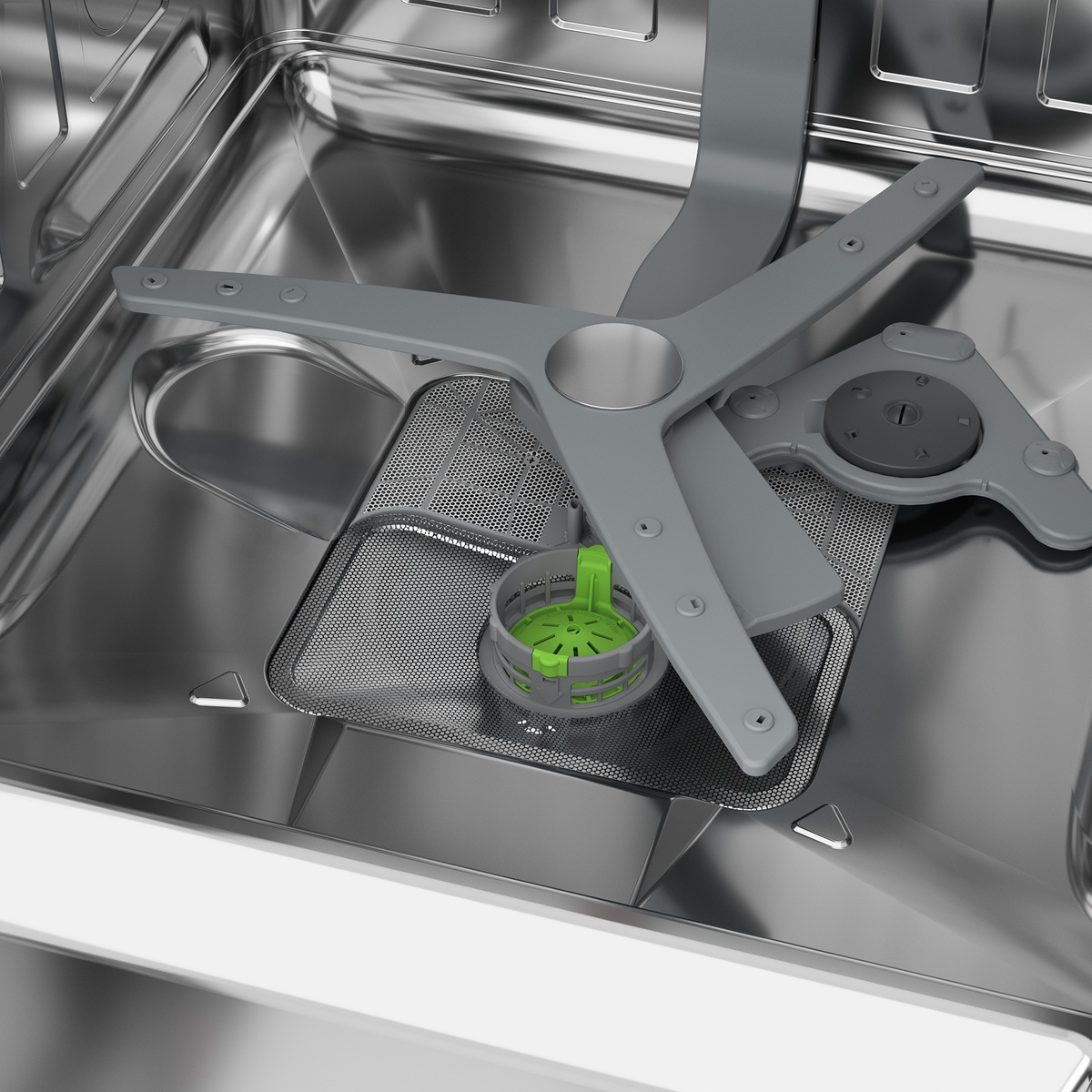 Close-up of dishwasher spray arm and filter area inside stainless tub