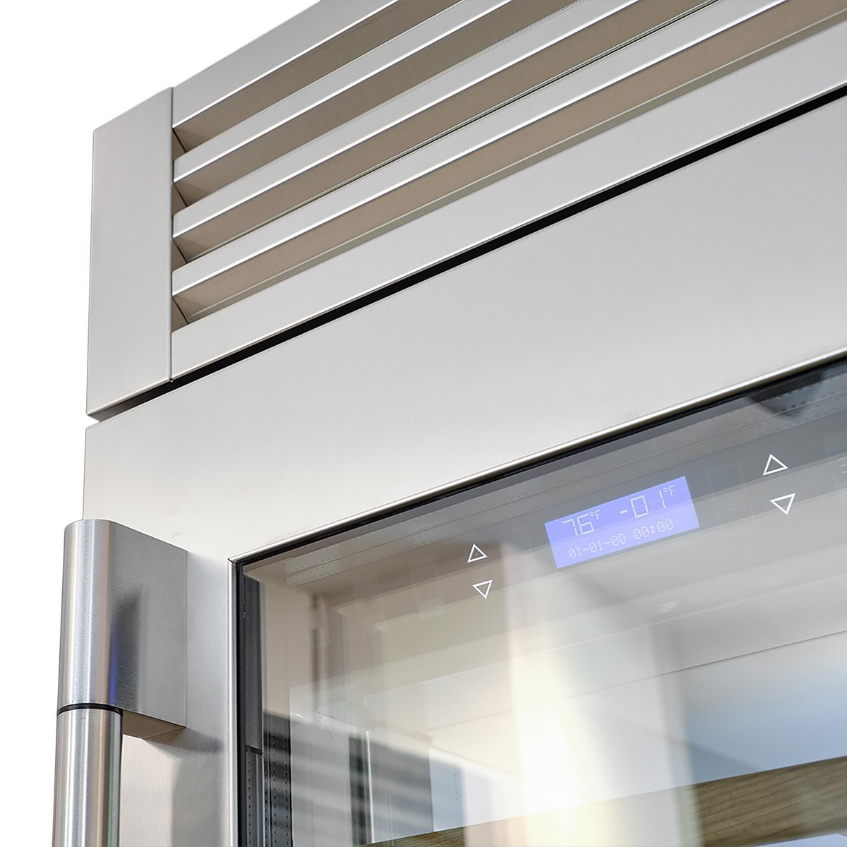 Close-up of stainless wine cellar top area with blue digital display behind glass