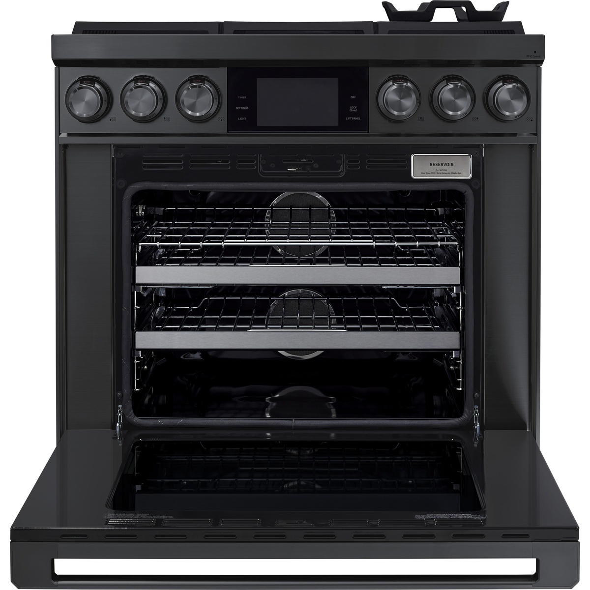Oven interior with multiple racks and visible reservoir label