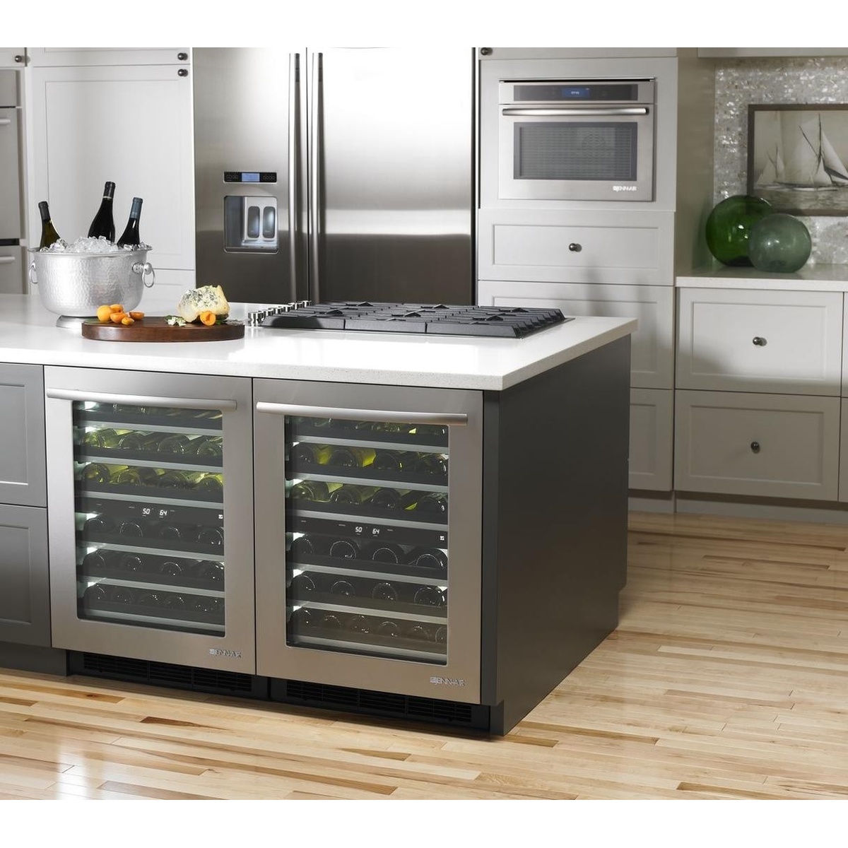 Modern kitchen with multiple built-in JennAir appliances, including undercounter units and a wall oven installed in cabinetry