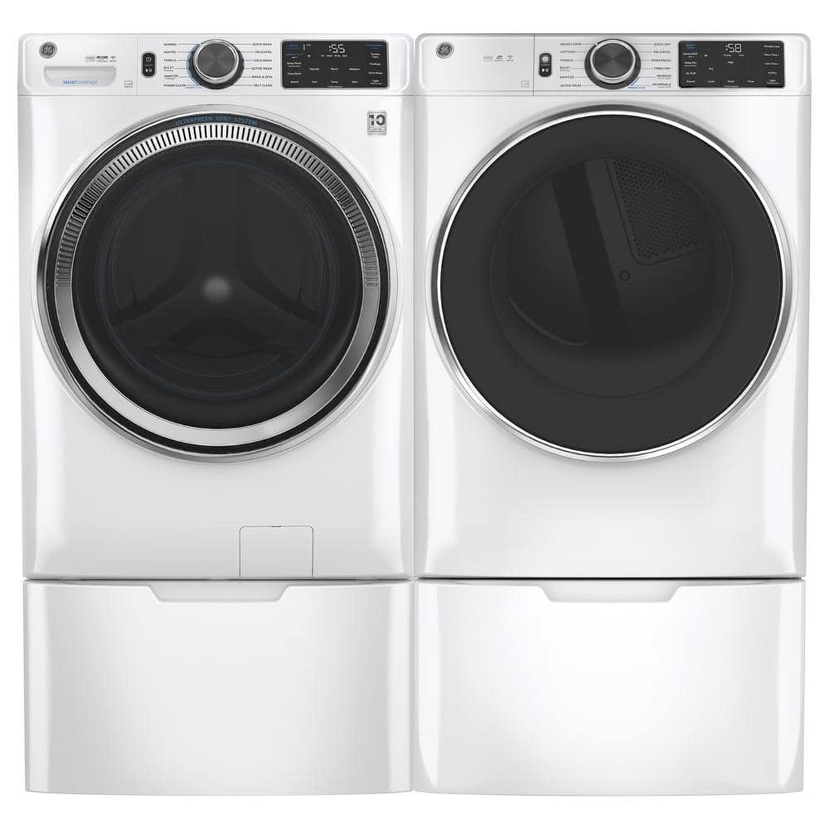 Matching GE washer and dryer shown side by side, each installed on a white pedestal drawer