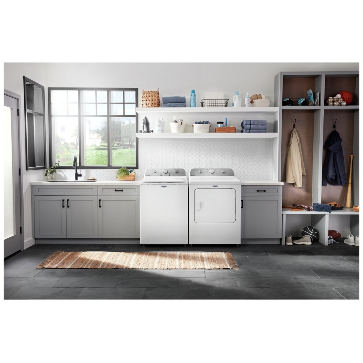 Maytag laundry pair installed side by side in a bright laundry room