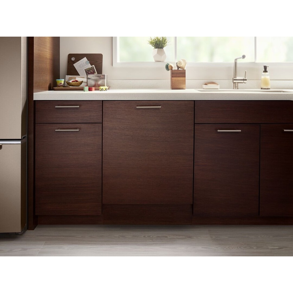 Kitchen cabinetry with a panel-ready dishwasher blended into the cabinet run