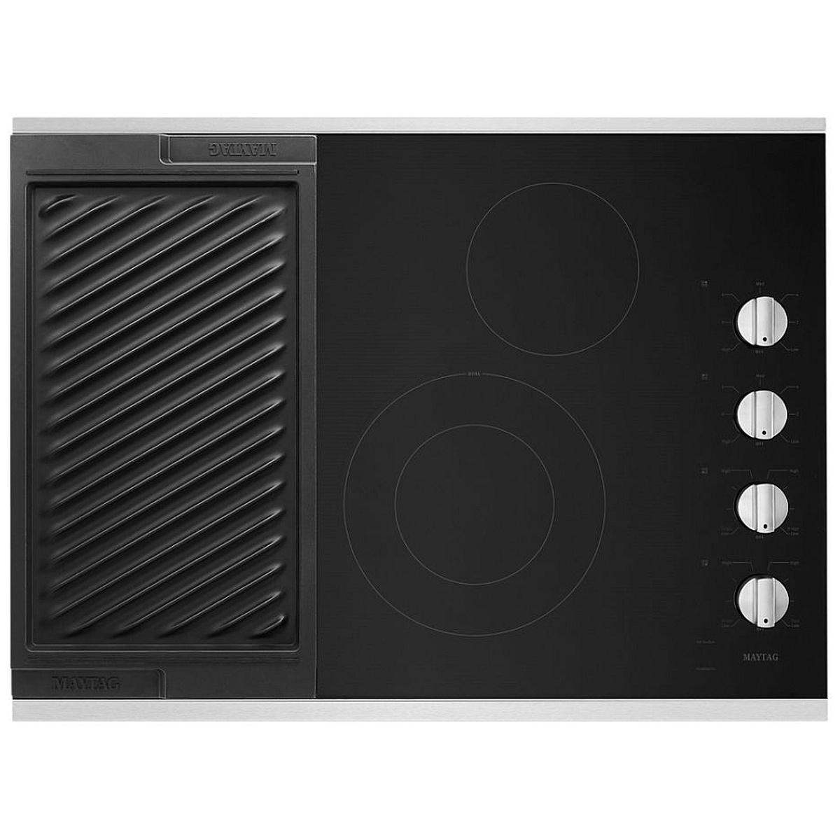 Top view of a Maytag black glass electric cooktop with a large ridged grill plate installed over the left side and four silver knobs on the right
