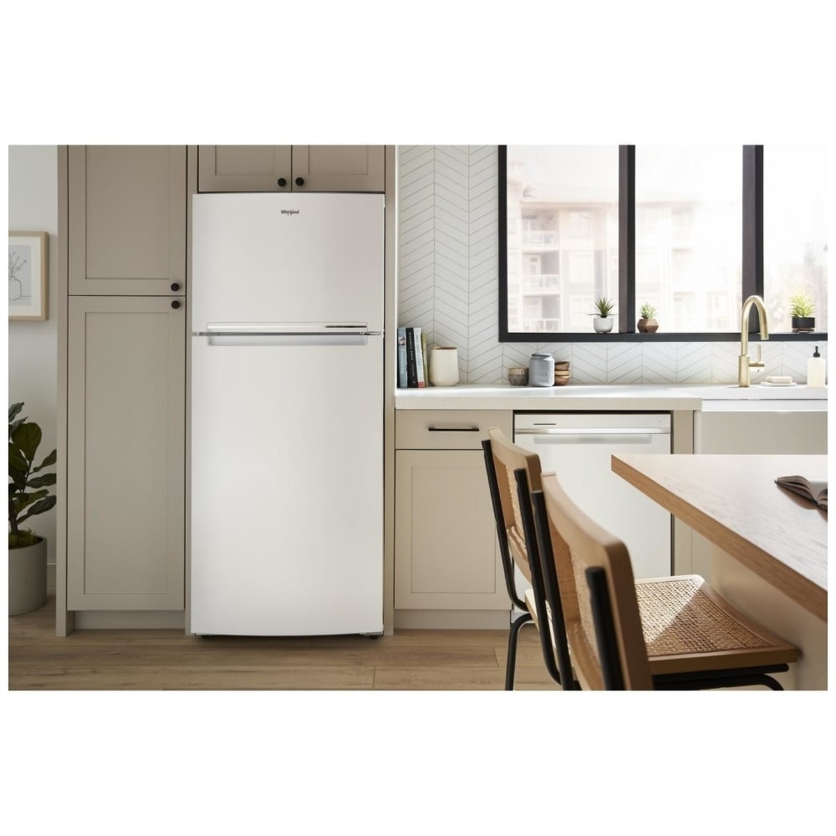 White Whirlpool top-freezer refrigerator installed in a modern kitchen