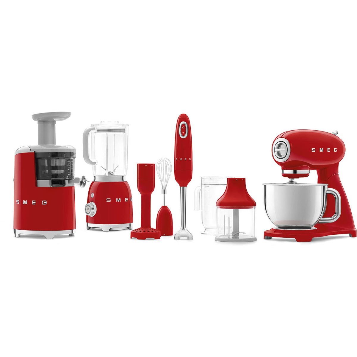 Assorted red Smeg countertop appliances displayed together, including a stand mixer, blender, immersion blender, and juicer