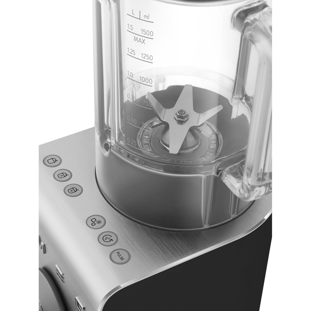 Close-up of the blender jug with measurement markings, stainless steel blade assembly, and top preset buttons including pulse