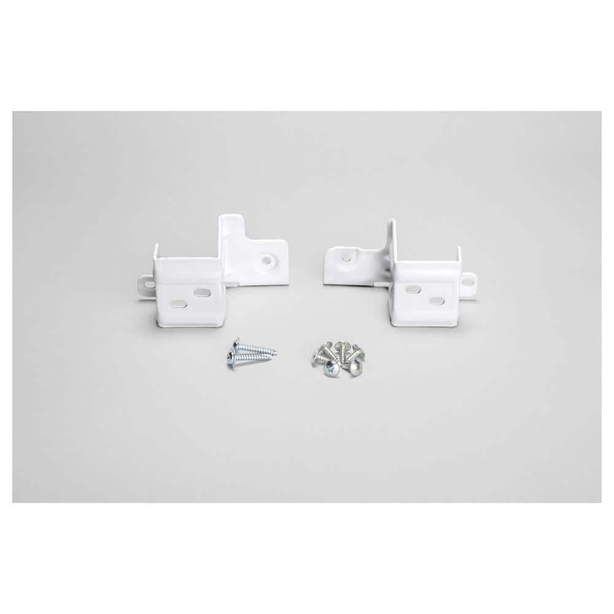 White metal stacking brackets with mounting screws for a washer and dryer stack