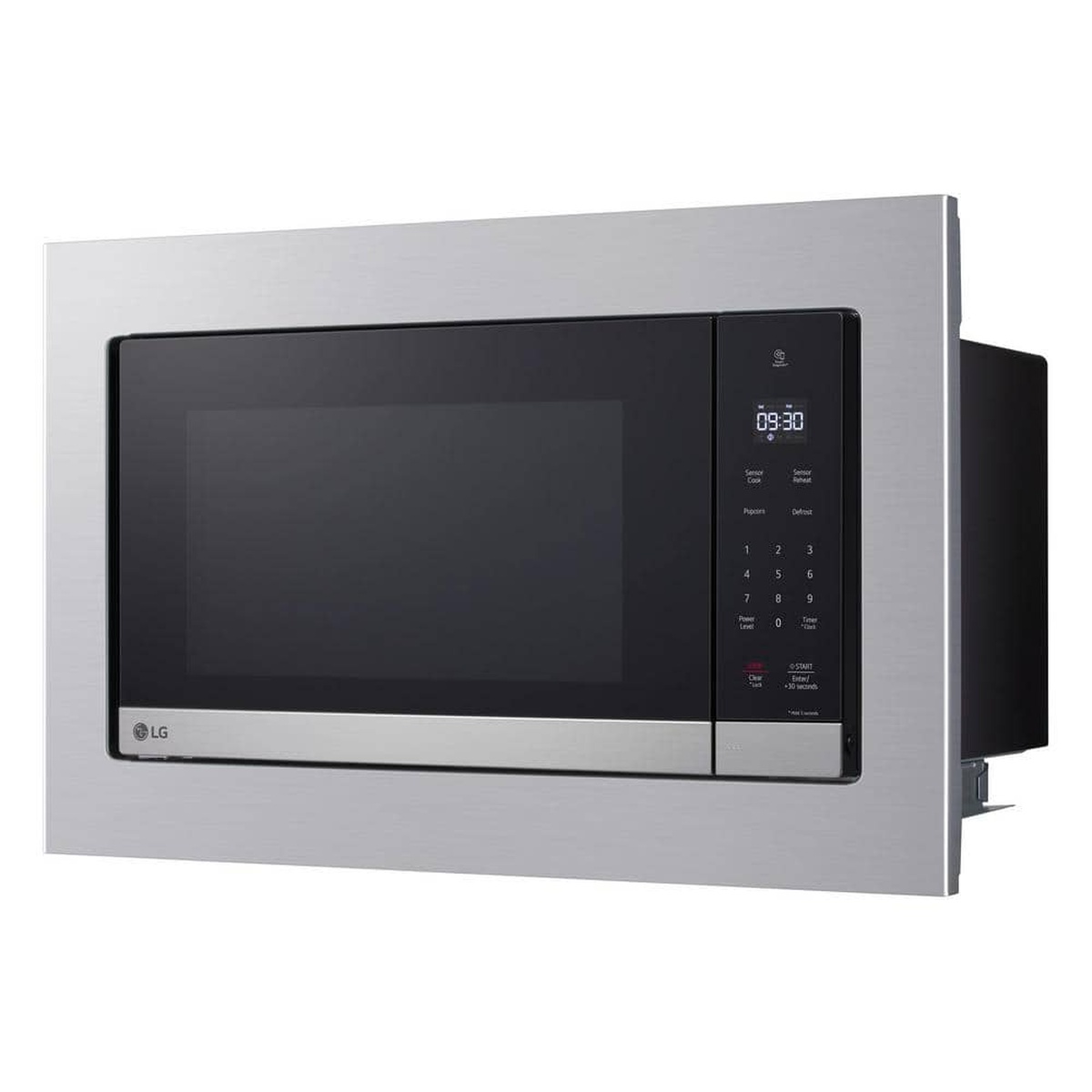 Front view of an LG microwave installed with a stainless trim kit, showing a wide frame around the microwave and a right-side control panel.