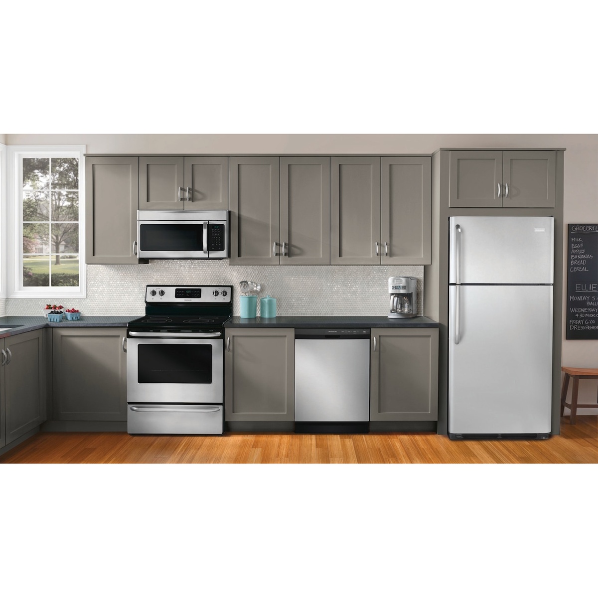 Modern kitchen featuring a Frigidaire dishwasher installed between cabinets with matching appliances