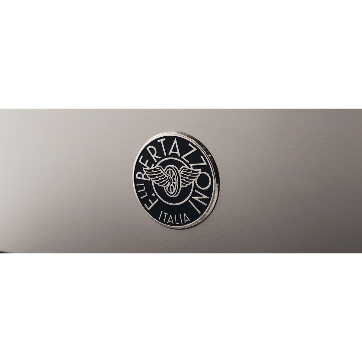 Close-up of the Bertazzoni Italia emblem badge on stainless steel