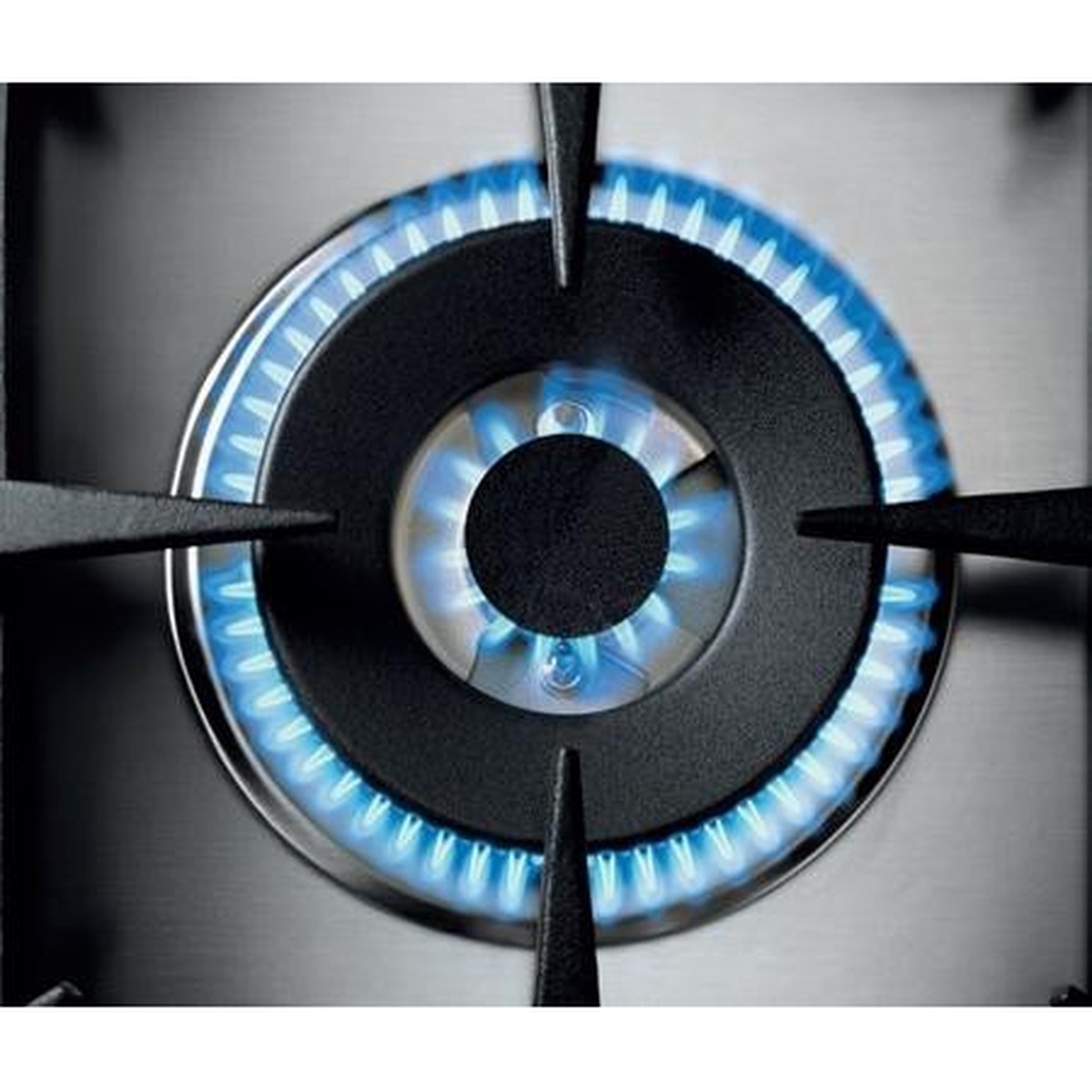 Close-up of a lit dual-ring gas burner showing an even blue flame around the burner cap
