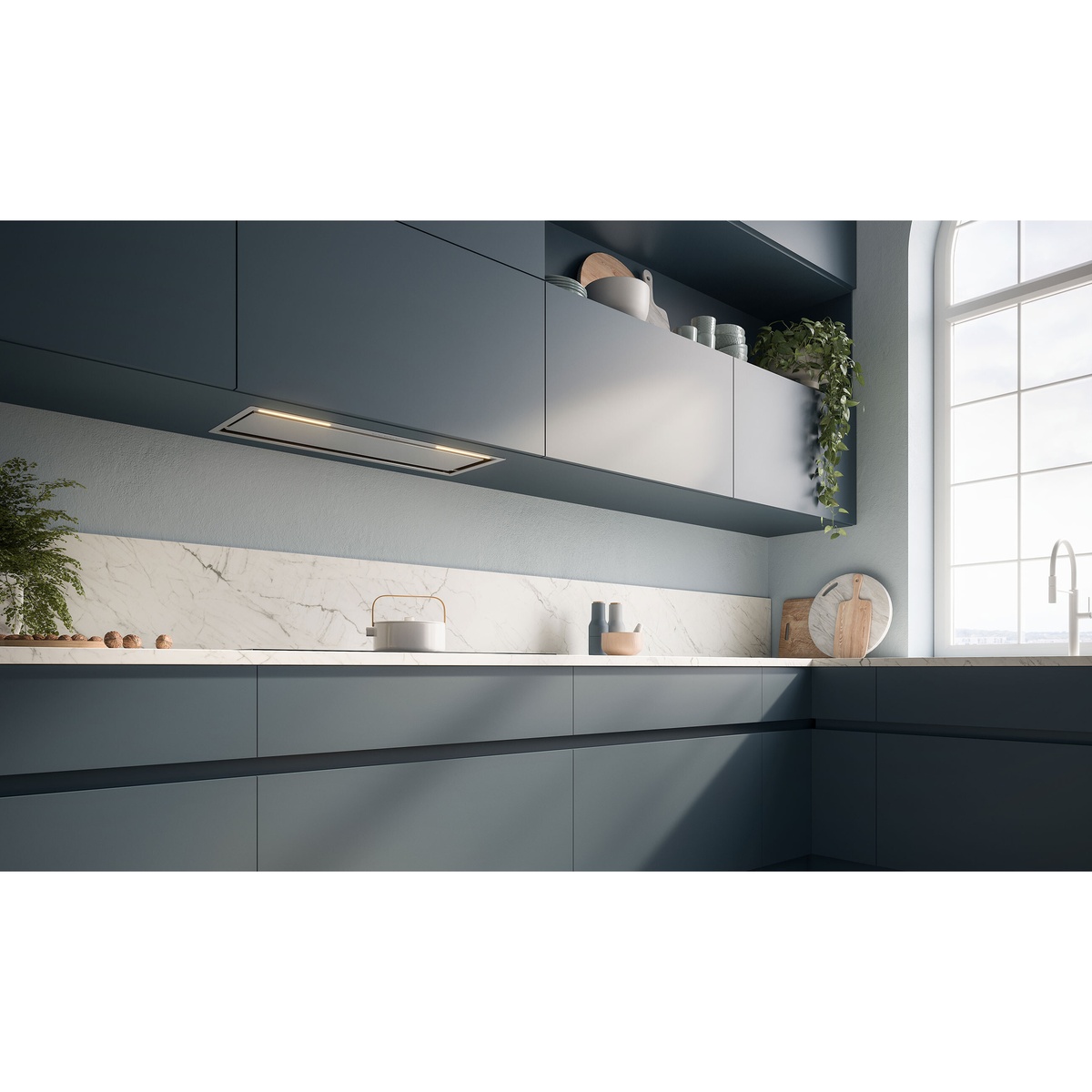 Modern kitchen with a built-in insert range hood installed under cabinetry above the countertop