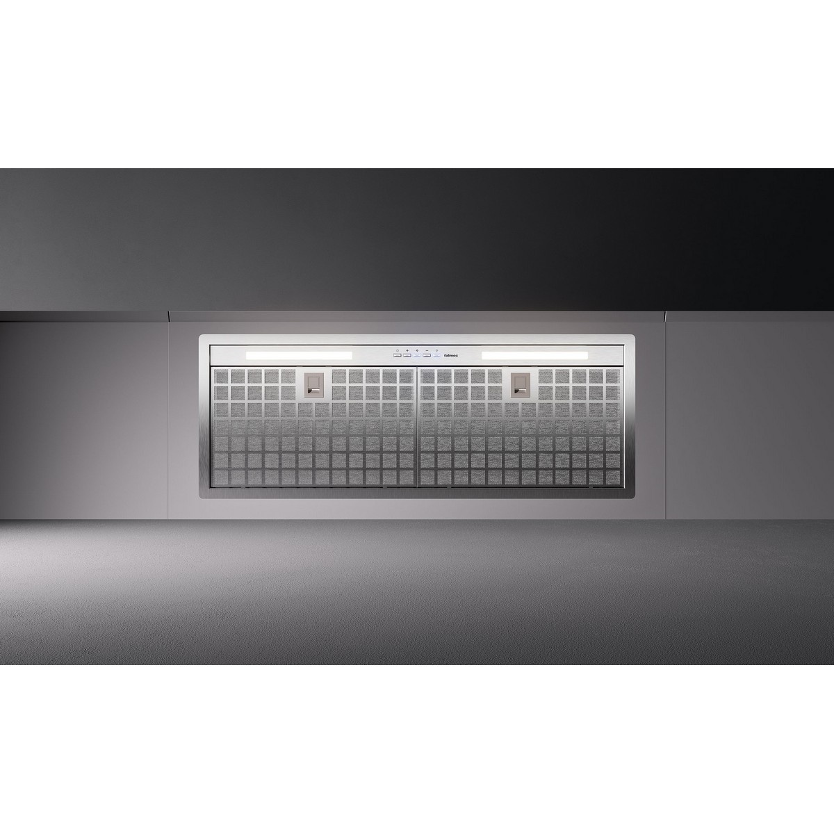Close-up of the Falmec built-in liner range hood underside showing mesh filters, push-button electronic controls, and two light bars