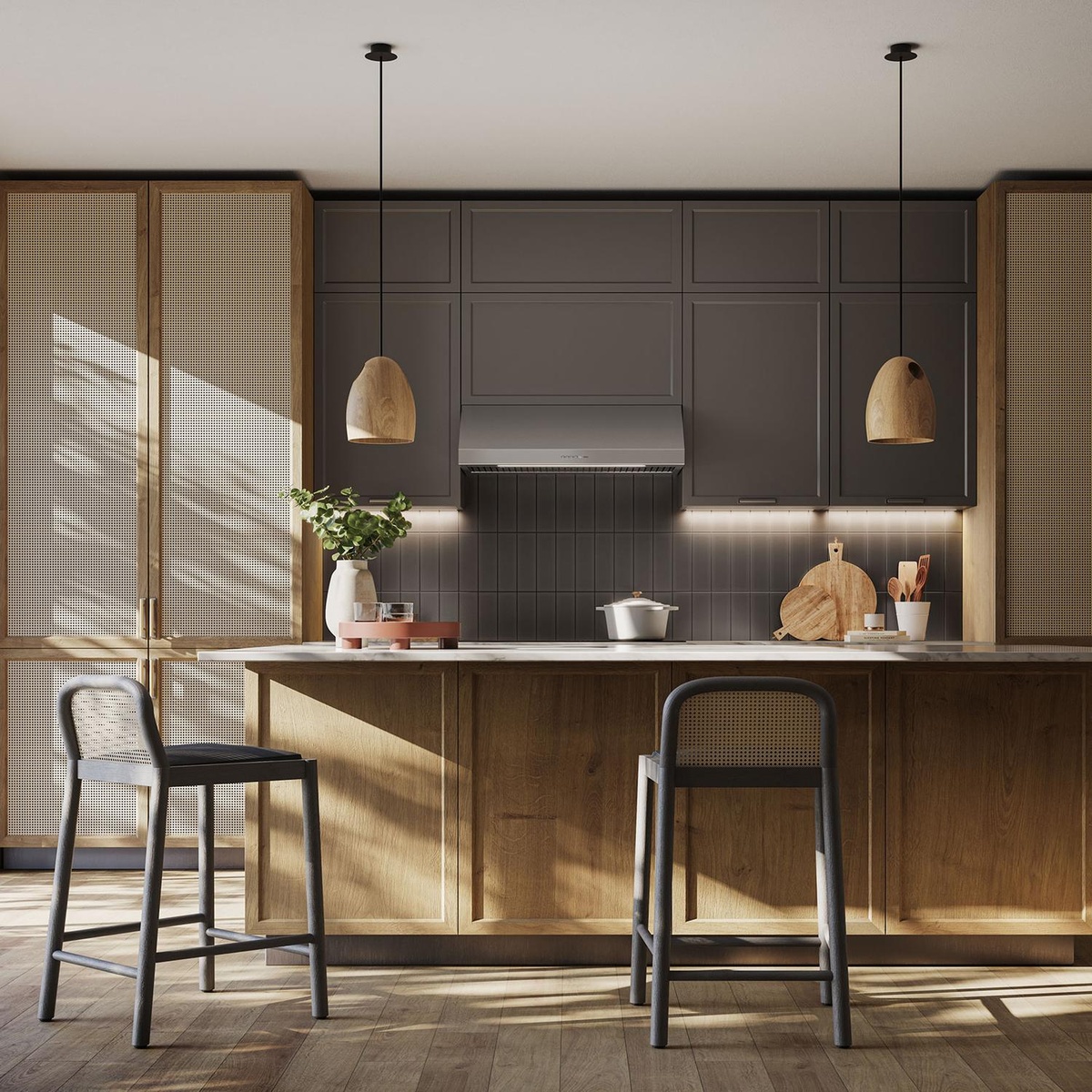 Lifestyle kitchen scene with a built-in stainless steel range hood installed between upper cabinets above a cooking area