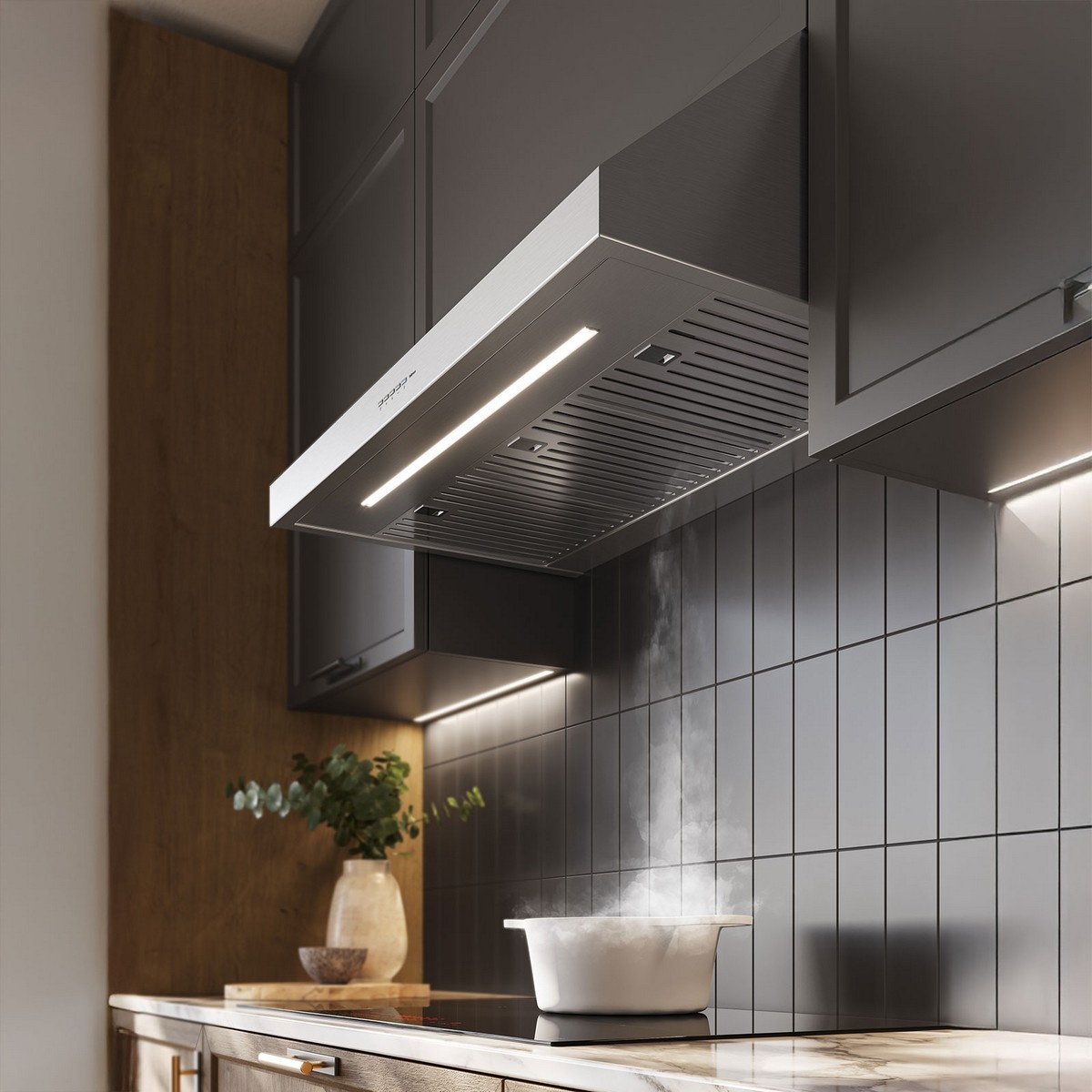 Close-up view of a stainless under-cabinet range hood showing the underside filter area and two bright light bars