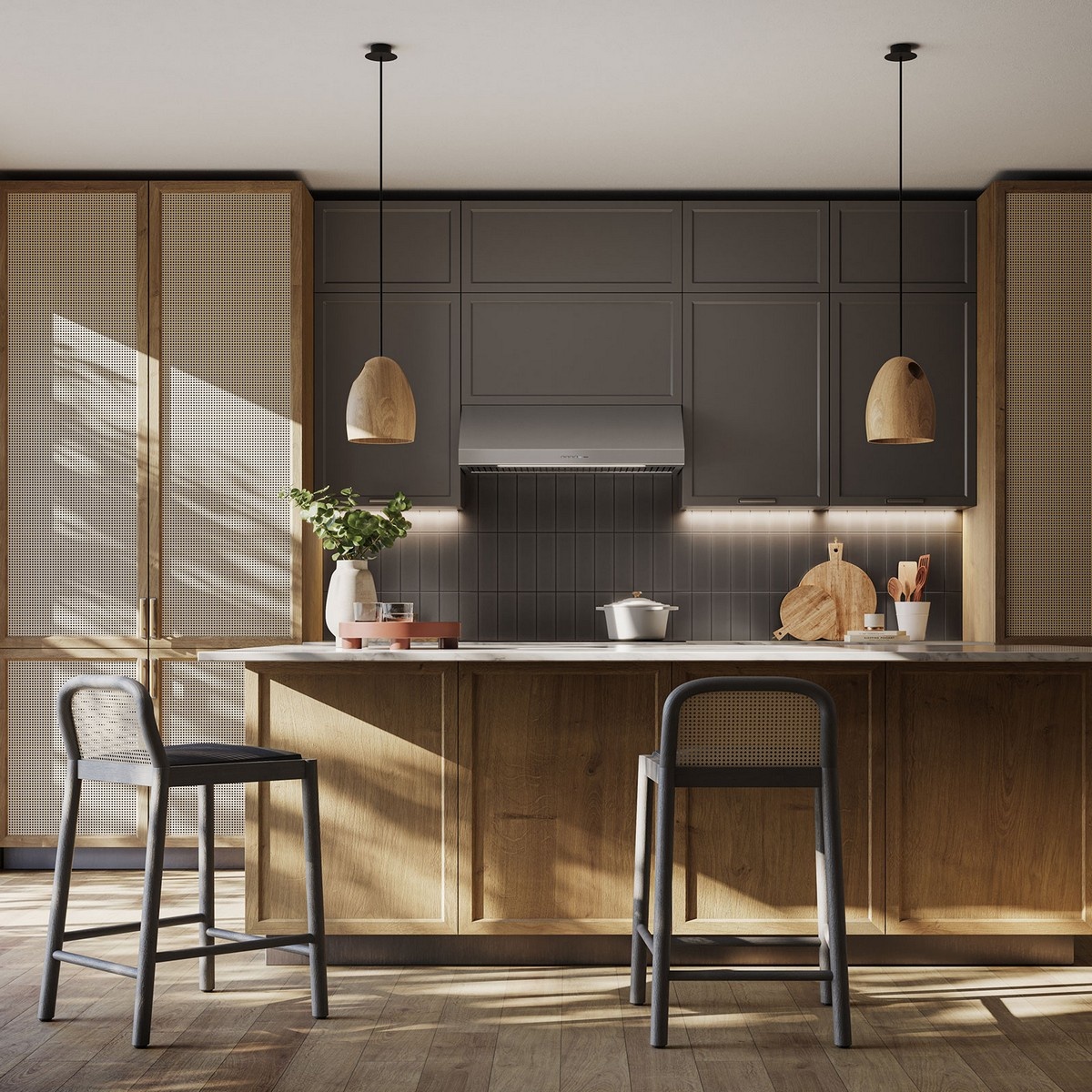 Modern kitchen scene with a stainless under-cabinet range hood installed between upper cabinets