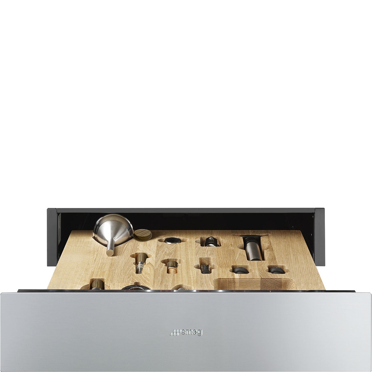 Front view of the Smeg stainless steel drawer partially open, showing a wooden organizer with cutouts for wine tools