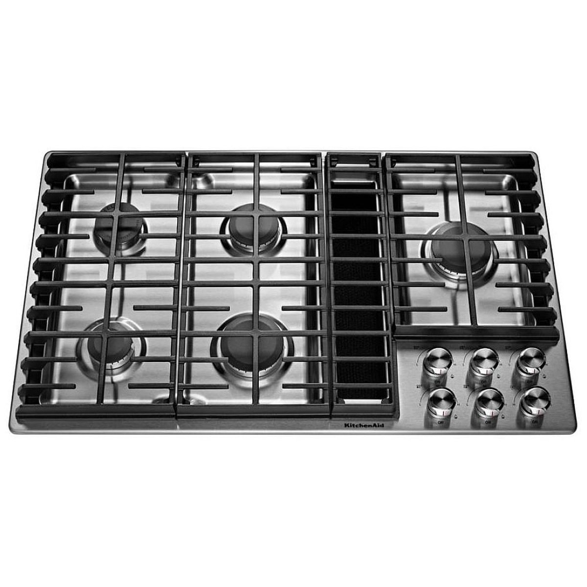 Top view of a KitchenAid stainless steel gas cooktop with five burners, continuous cast-iron grates, a center downdraft vent, and right-side control knobs