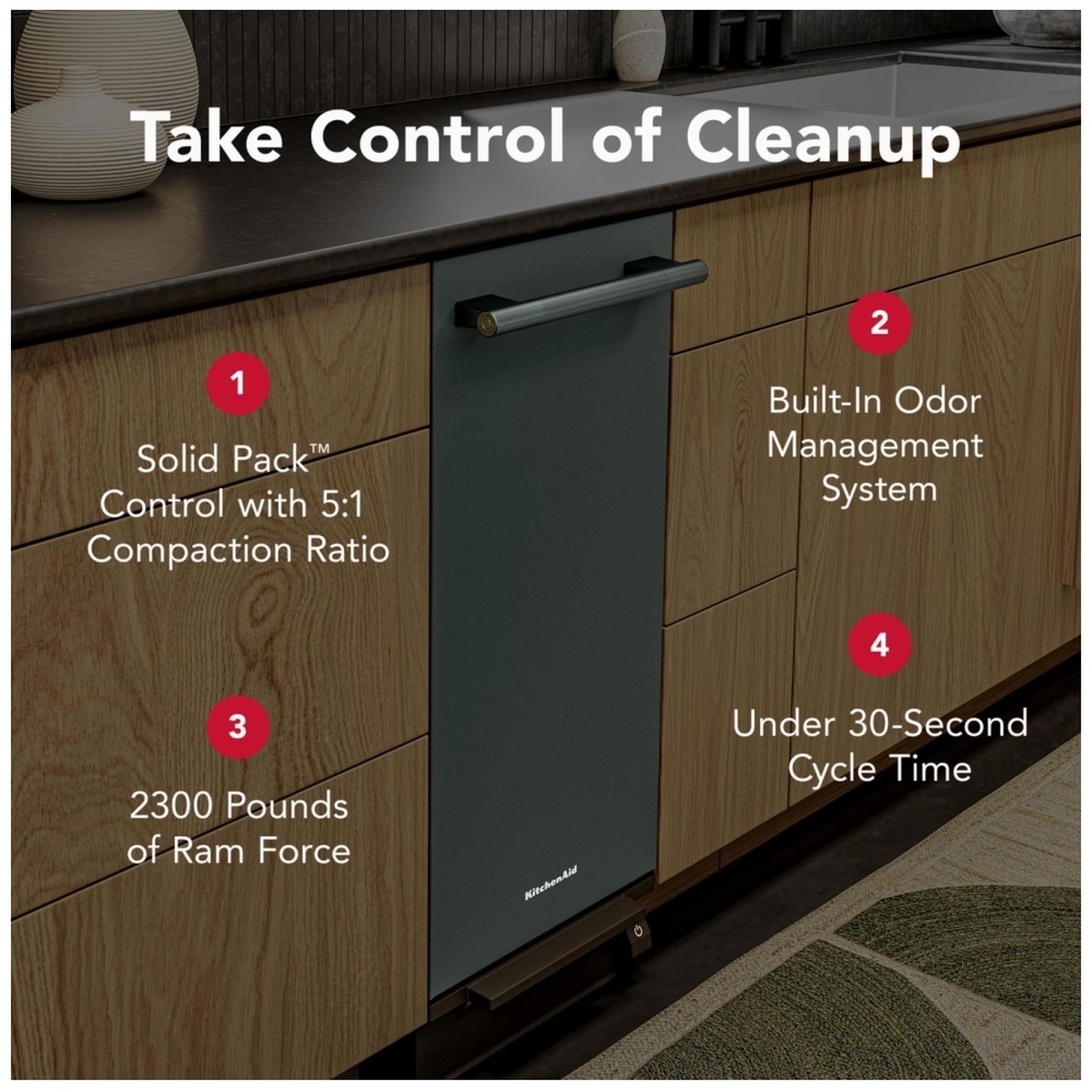 KitchenAid KTTP515TJP built-in trash compactor installed flush in a kitchen cabinet with feature callouts highlighting Solid Pack Control, Odor Management System, Ram Force and Cycle Time