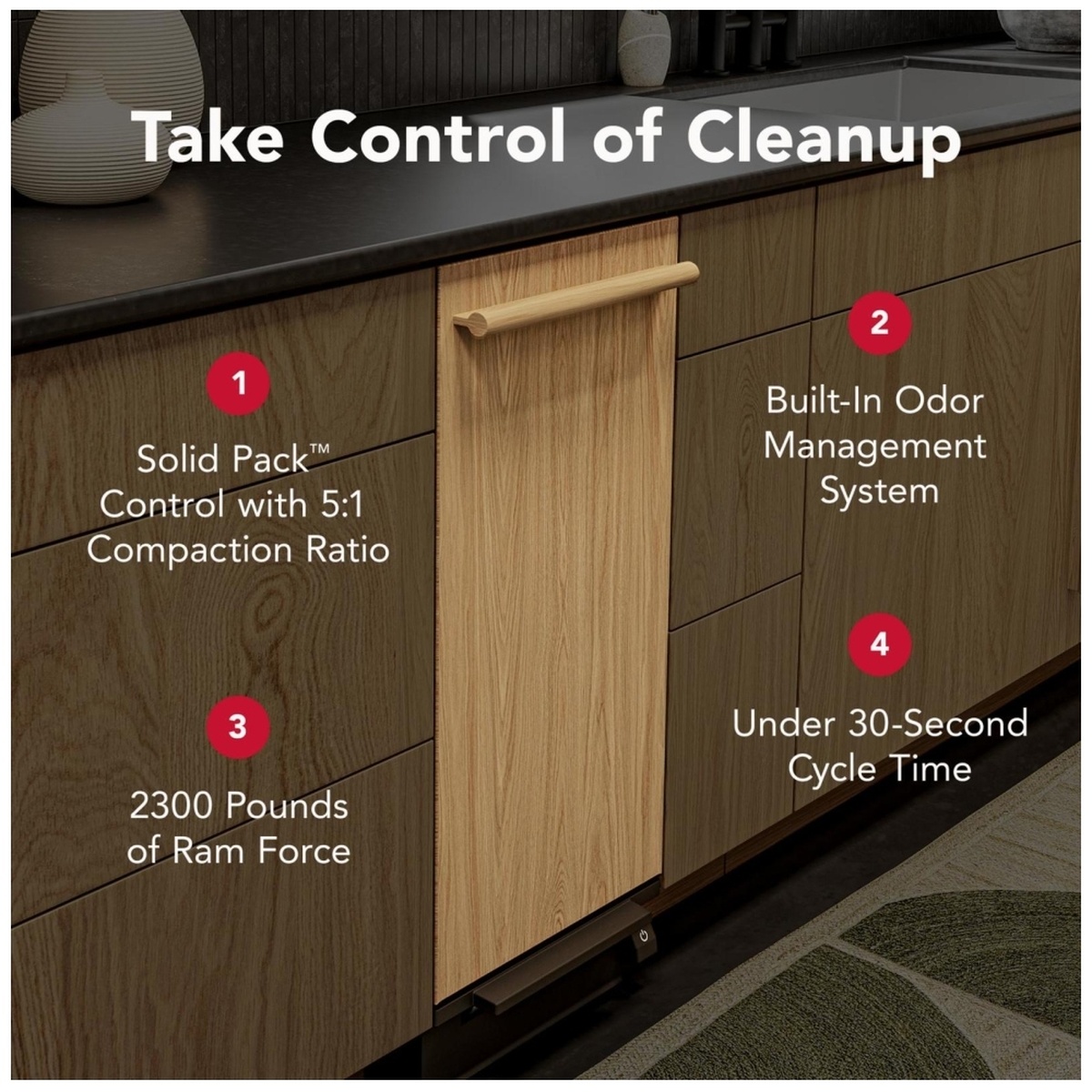 KitchenAid KTTP515TPA installed in a dark wood kitchen with marketing callouts highlighting Solid Pack Control 5:1 compaction ratio, Built-In Odor Management System, 2300 lbs of ram force, and under 30-second cycle time