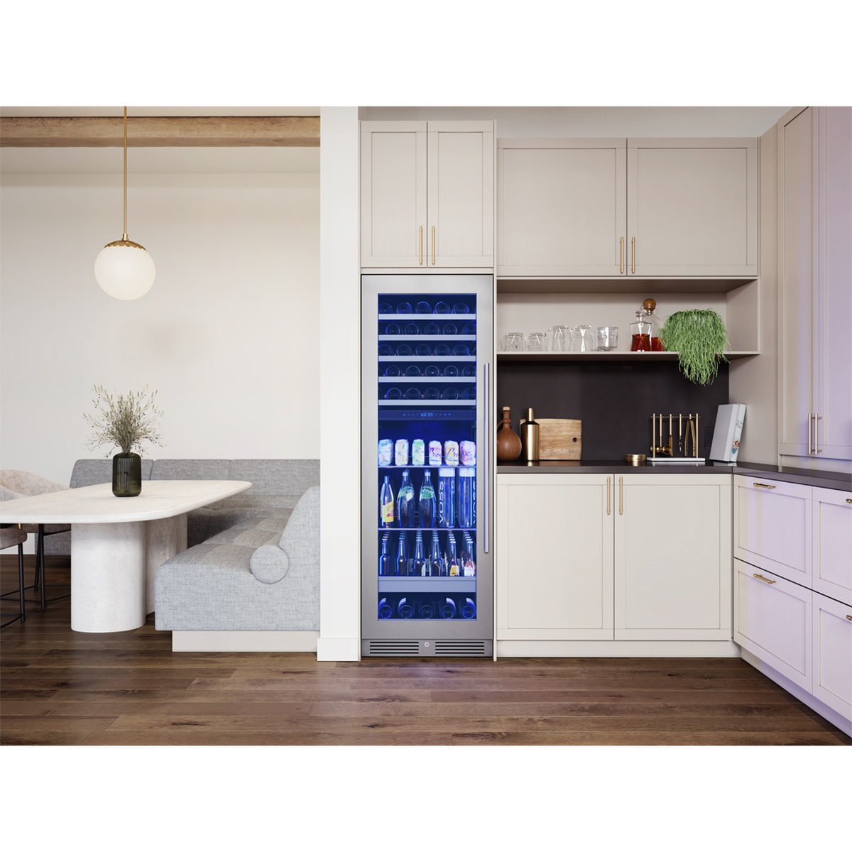 Presrv PRWB24F02BG dual-zone wine and beverage cooler installed flush between kitchen cabinetry, fully loaded with wine bottles on wood racks in the upper zone and beverages in the lower zone, illuminated with blue LED lighting