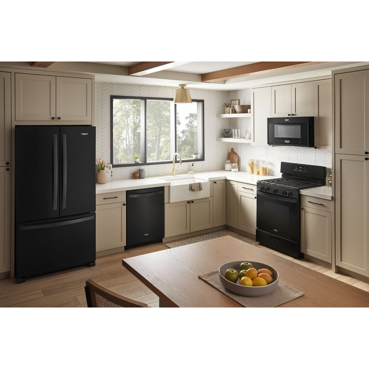 Full black Whirlpool appliance suite including refrigerator, dishwasher, range, and microwave installed in a modern kitchen with cream cabinetry