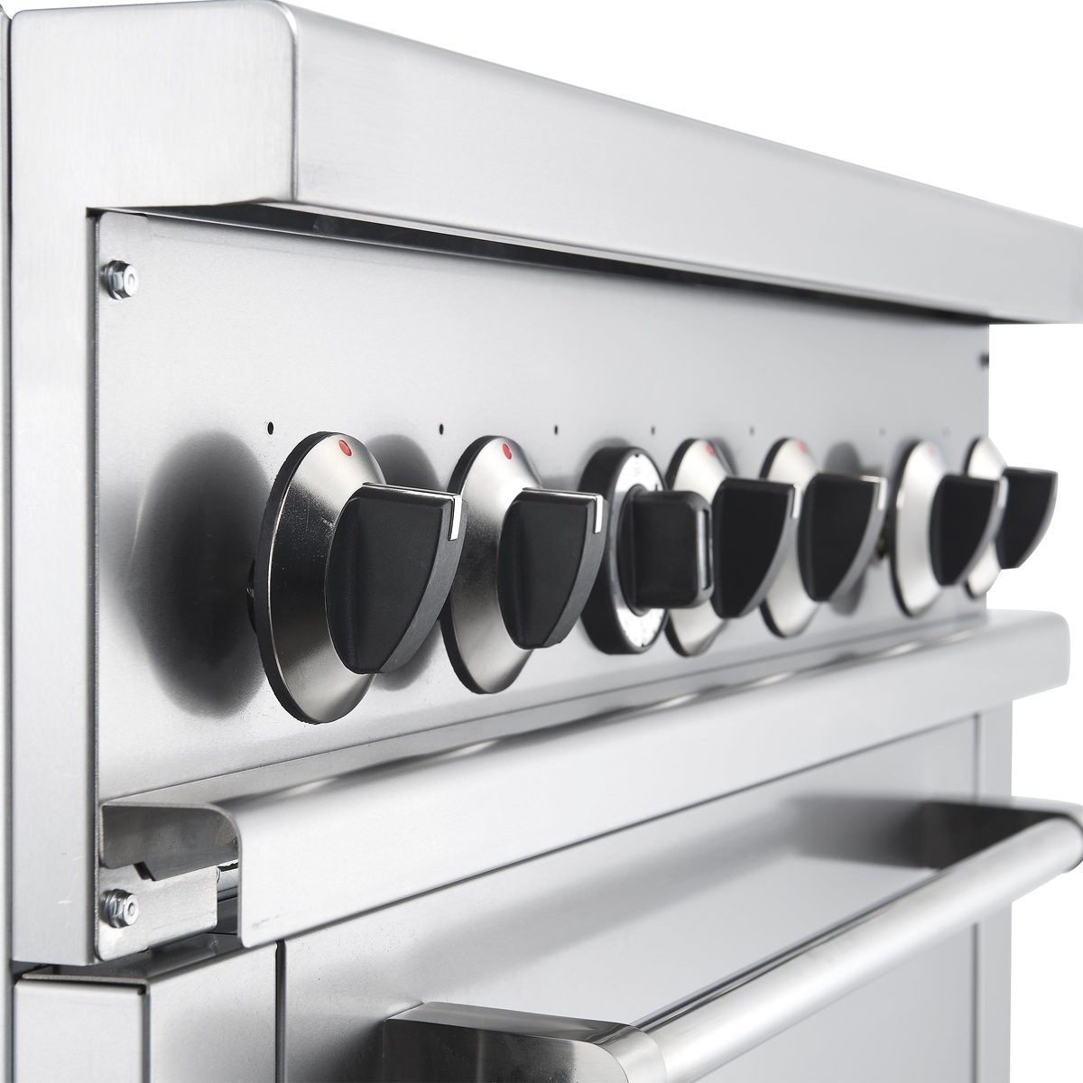 Close-up of the range control panel showing the row of large round control knobs on a stainless steel front
